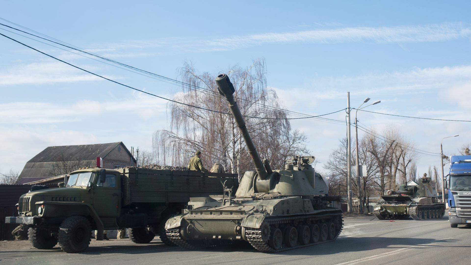 Military vehicles are seen along a street on February 25, 2022 in Kyiv, Ukraine.