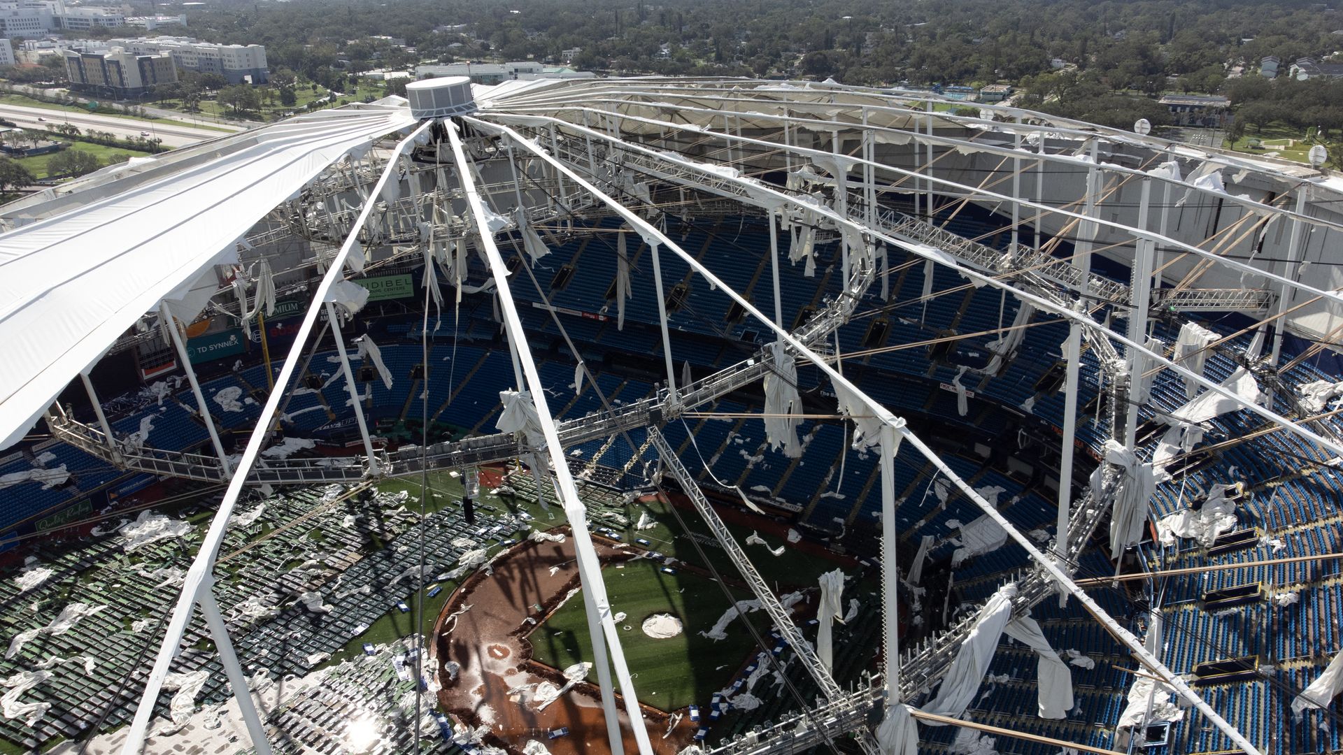 A drone image shows the dome of Tropicana Field which has been torn open due to Hurricane Milton in St. Petersburg, Florida, on October 10, 2024. At least four people were confirmed killed as a result of two tornadoes triggered by Hurricane Milton on the east coast of the US state of Florida, local 