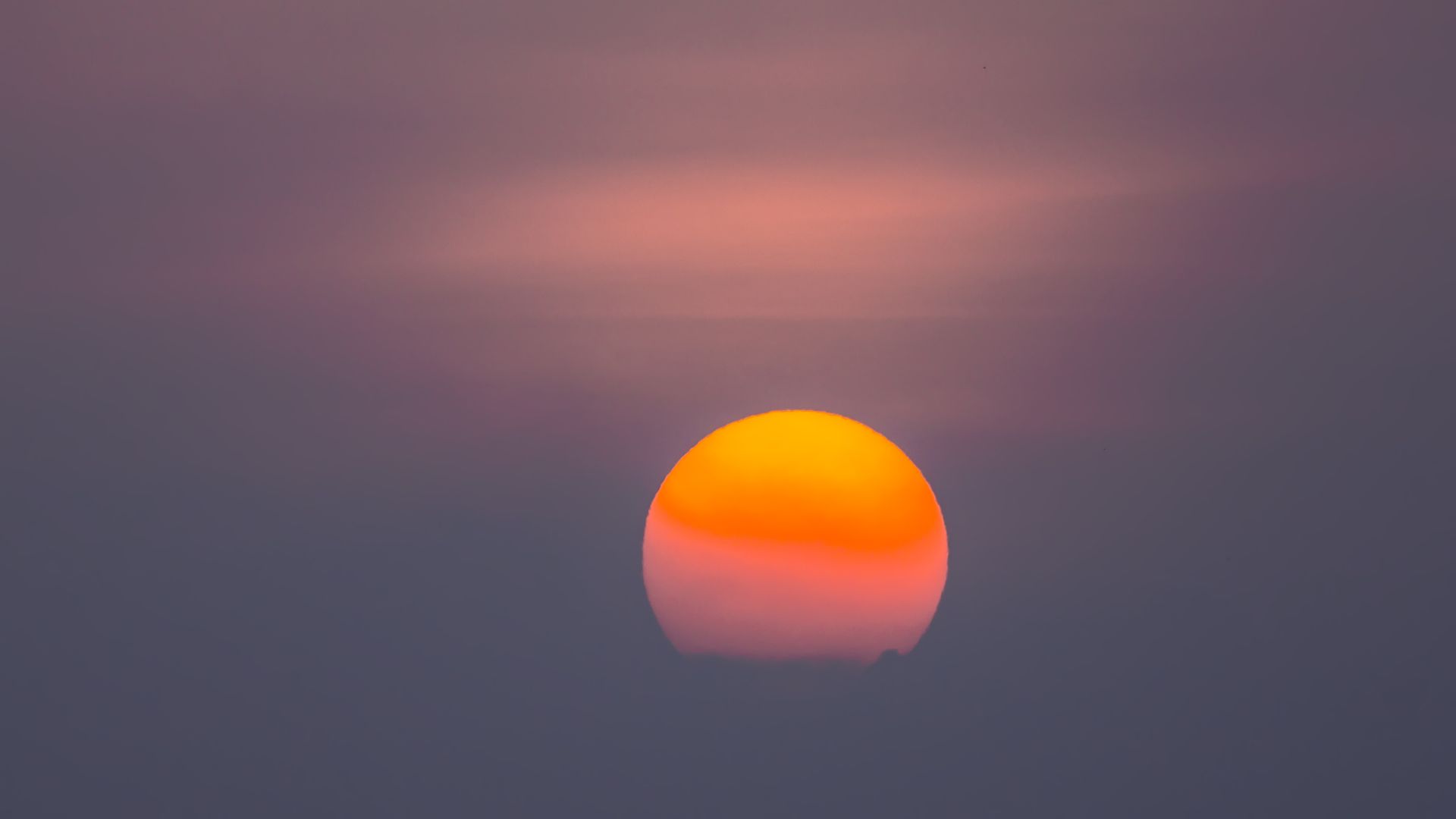 Image of a hazy sun setting.