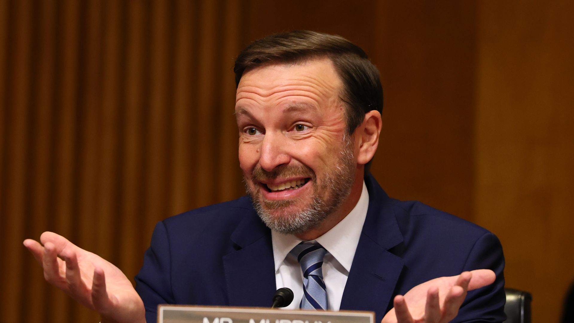 Connecticut Sen. Chris Murphy shrugs, with both palms up.