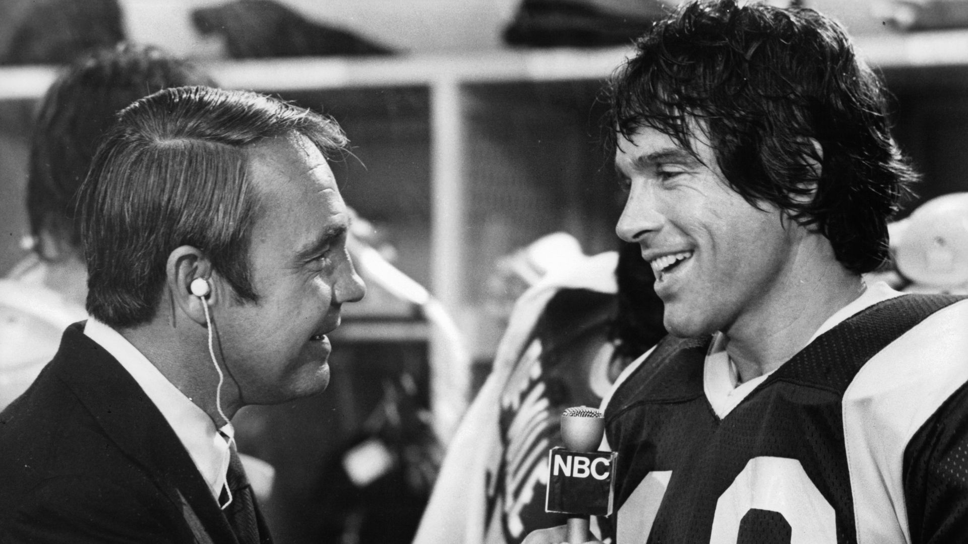 Dick Enberg interviews Warren Beatty after Super Bowl victory in a scene from the film 'Heaven Can Wait', 1978.