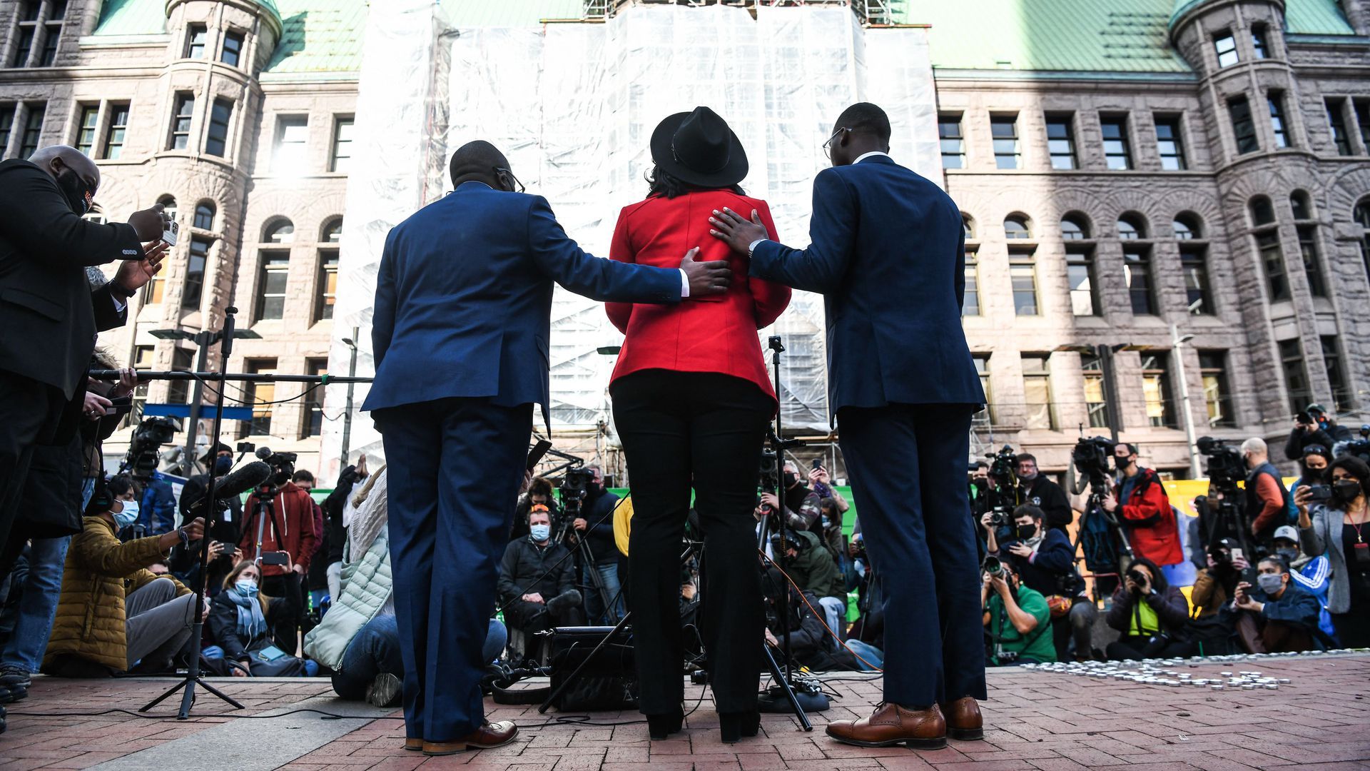 George Floyd's sister Bridgett Floyd is consoled as she speaks outside the Hennepin County Government Center