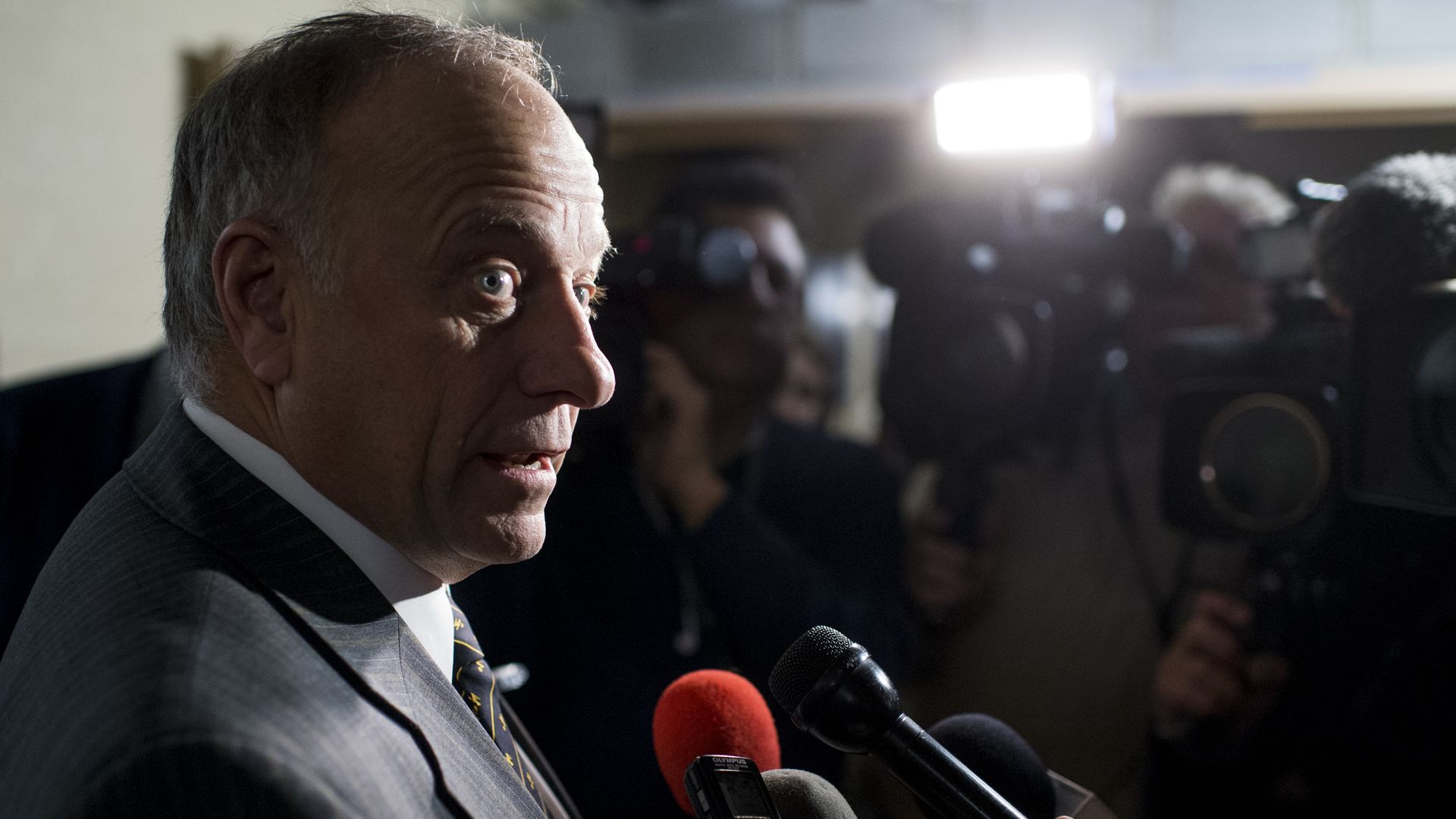 Rep. Steve King looks surprised talking to reporters.