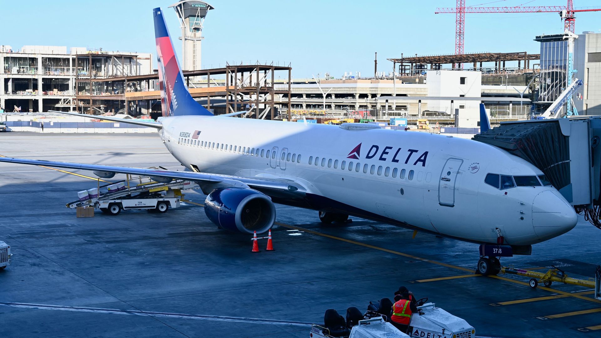 A Delta Air Lines jet parked at a gate