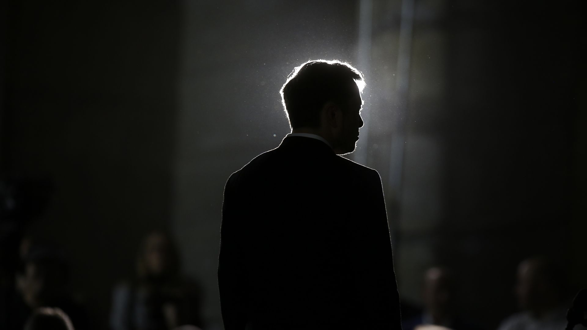 Here is Tesla CEO Elon Musk draped in shadows