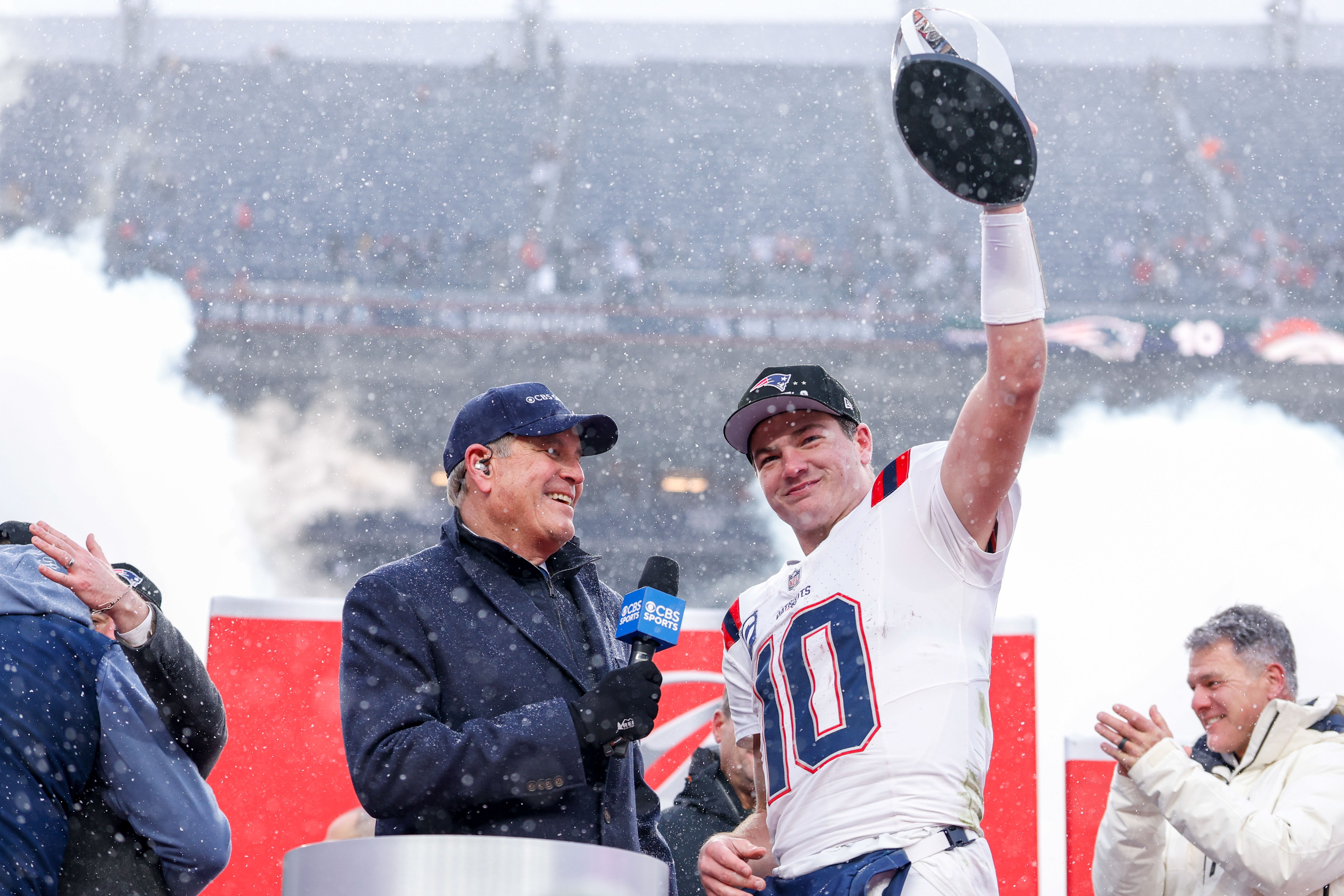DENVER, COLORADO - JANUARY 25: Drake Maye #10 of the New England Patriots lifts the Lamar Hunt AFC Championship trophy after the AFC Championship game against the Denver Broncos at Empower Field At Mile High on January 25, 2026 in Denver, Colorado. (Photo by Lauren Leigh Bacho/Getty Images)