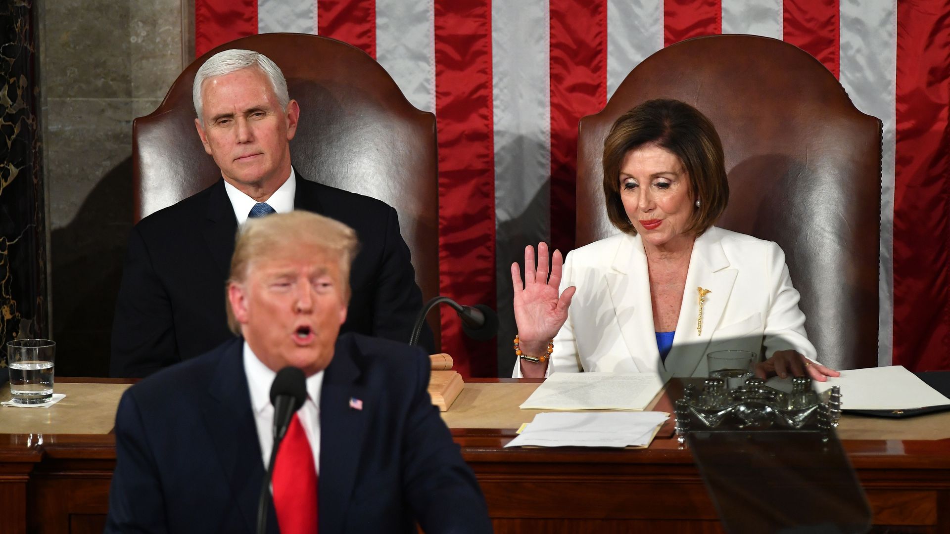 President Trump delivers the State of the Union address flanked by US Vice President Mike Pence (L) and Nancy Pelosi (R) at the US Capitol