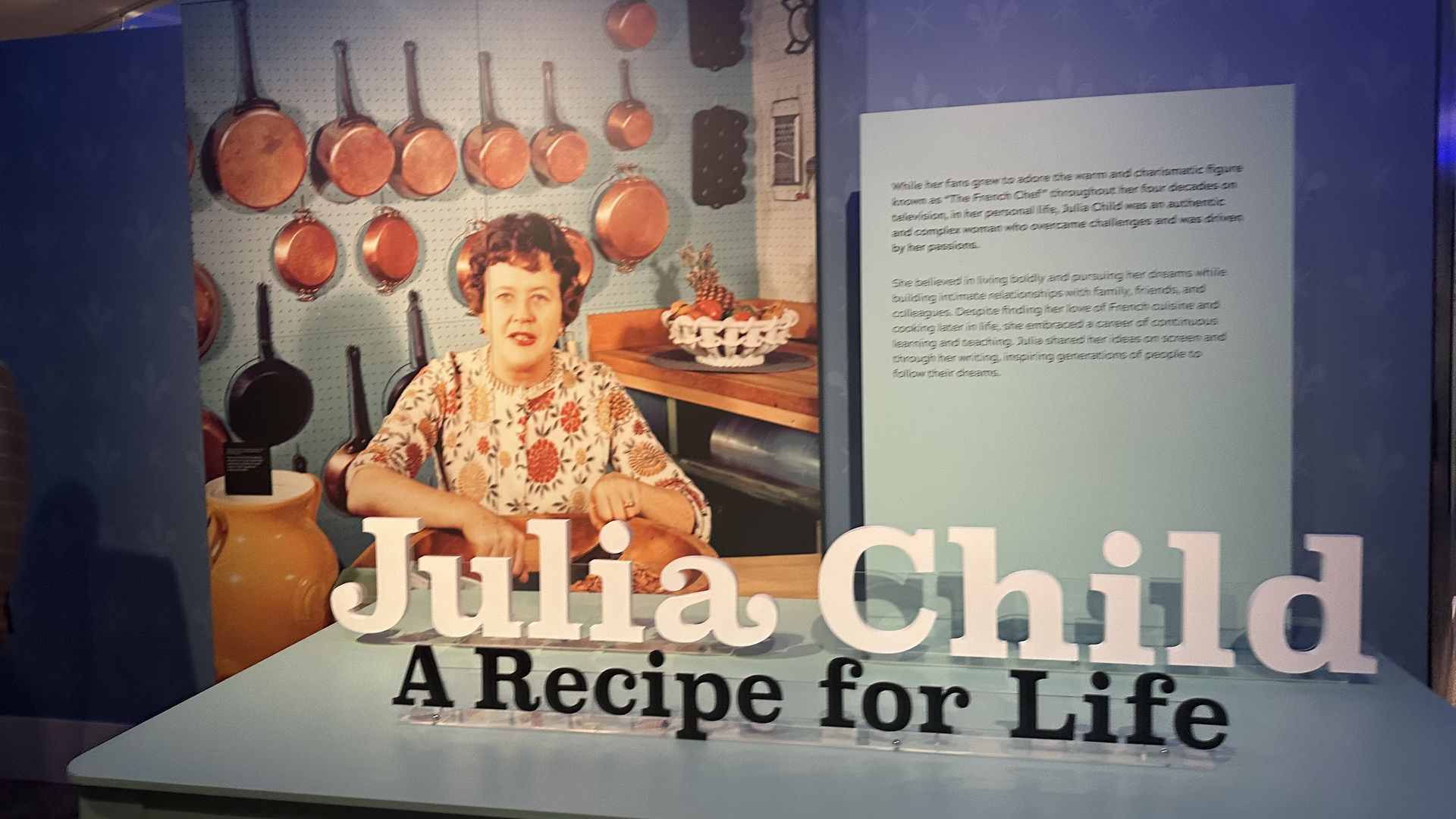 A giant pic of Julia Child with the name of the exhbit 
