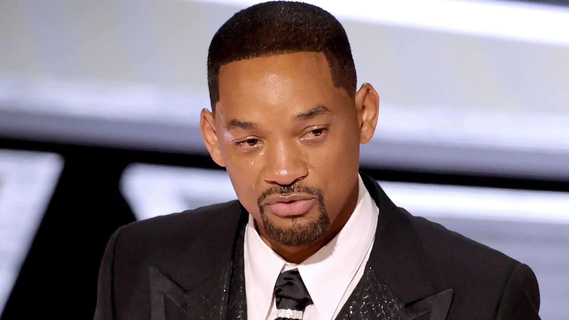 Will Smith accepts the best actor award at the Oscars.