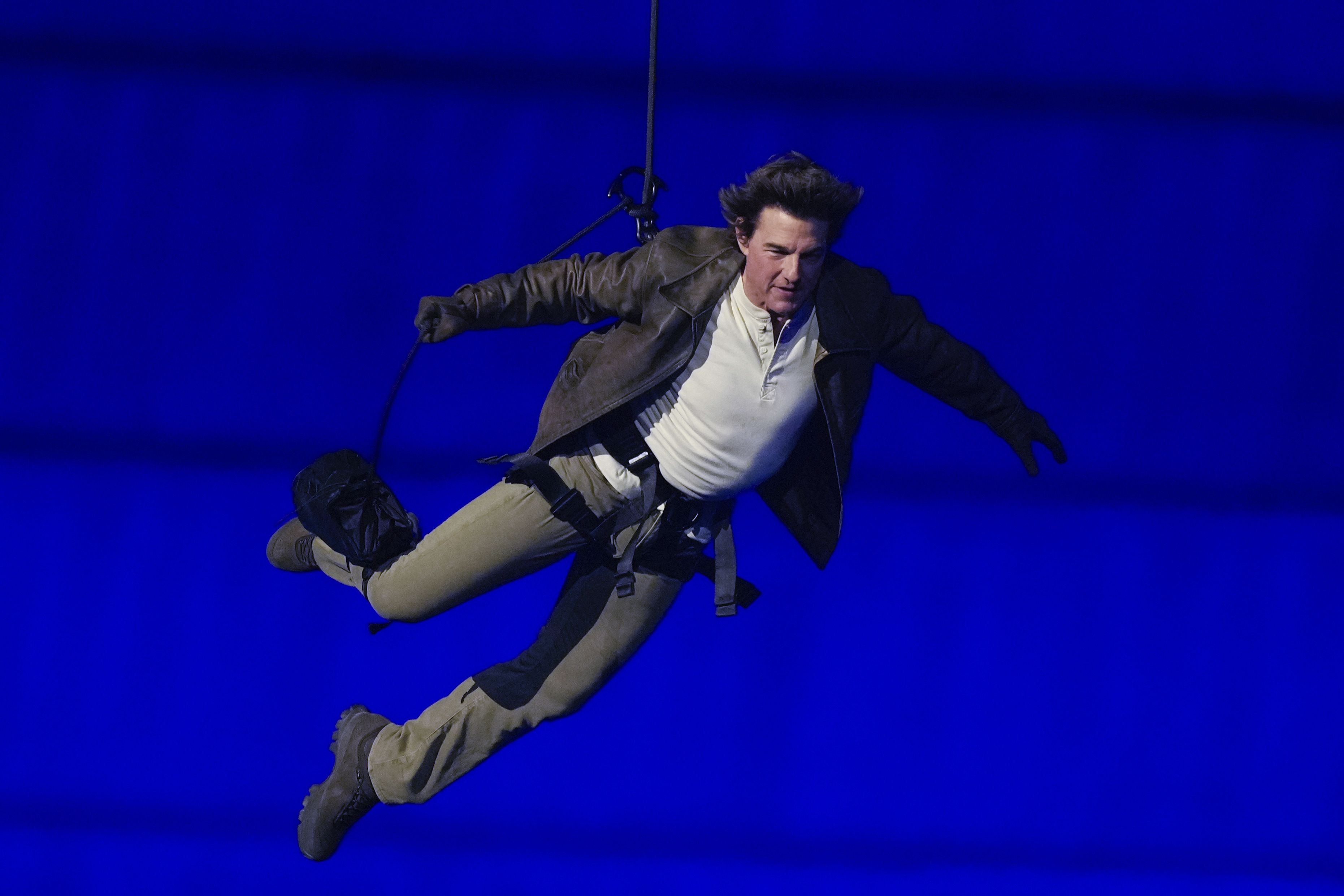 Tom Cruise is lowered into the Paris Olympics closing ceremony yesterday.