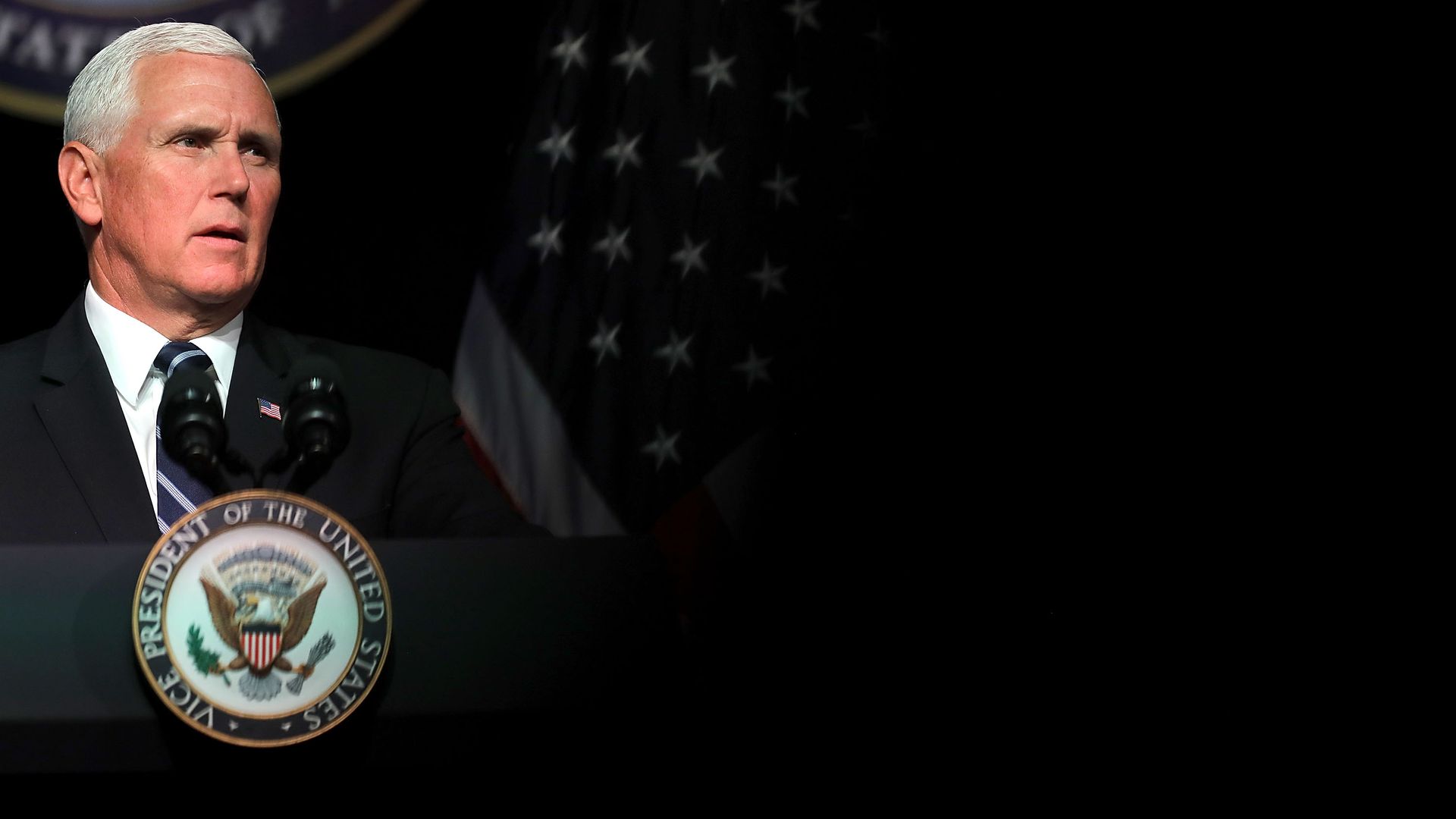 Vice President Mike Pence speaking at a podium.