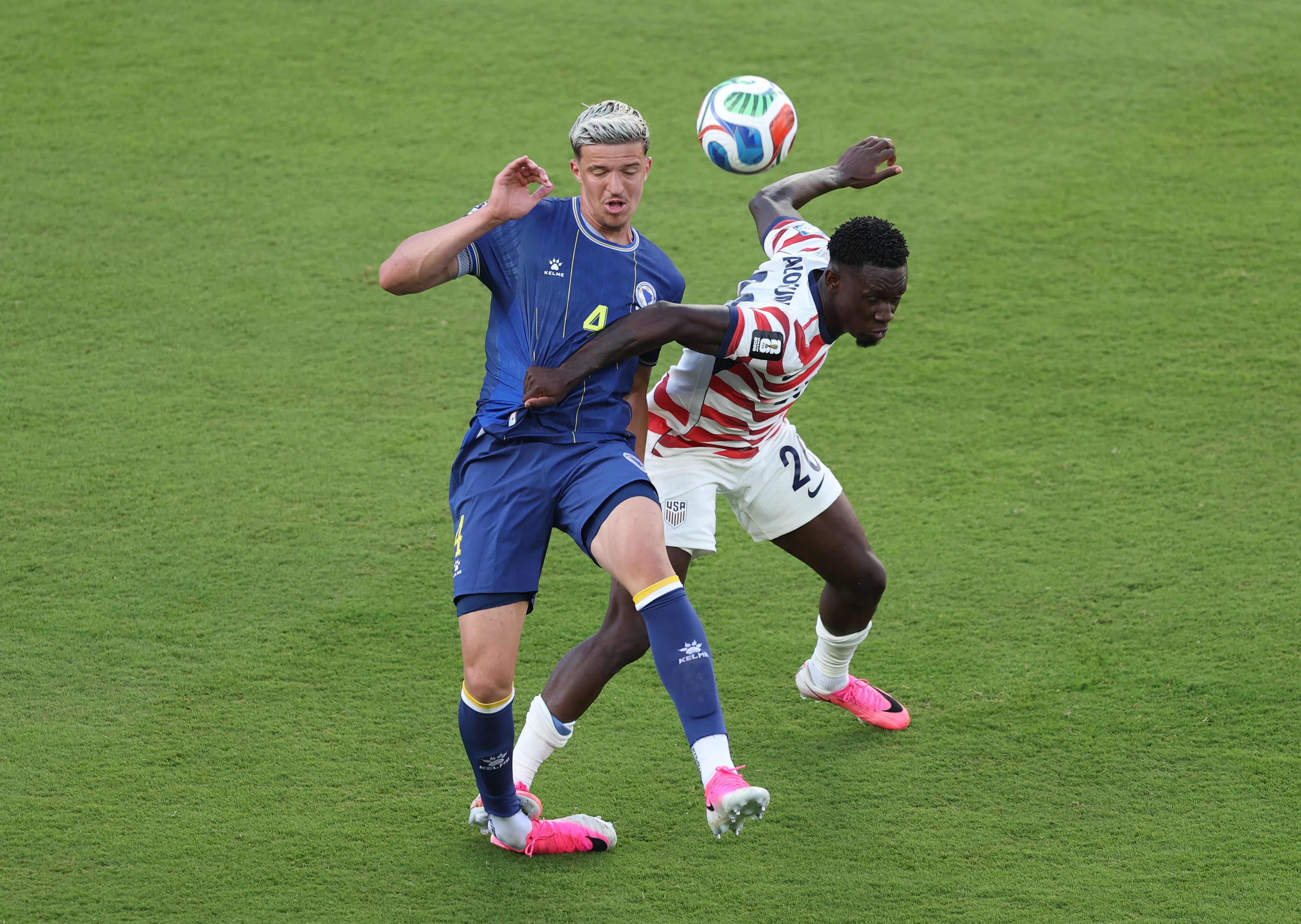  Folarin Balogun #20 of the United States fouls Tarik Muharemovic #4 of Bosnia and Herzegovina which is later reviewed by VAR and awarded as a red card foul a during the FIFA World Cup 2026 Round of 32 match between USA and Bosnia and Herzegovina at San Francisco Bay Area Stadium on July 01, 2026 in