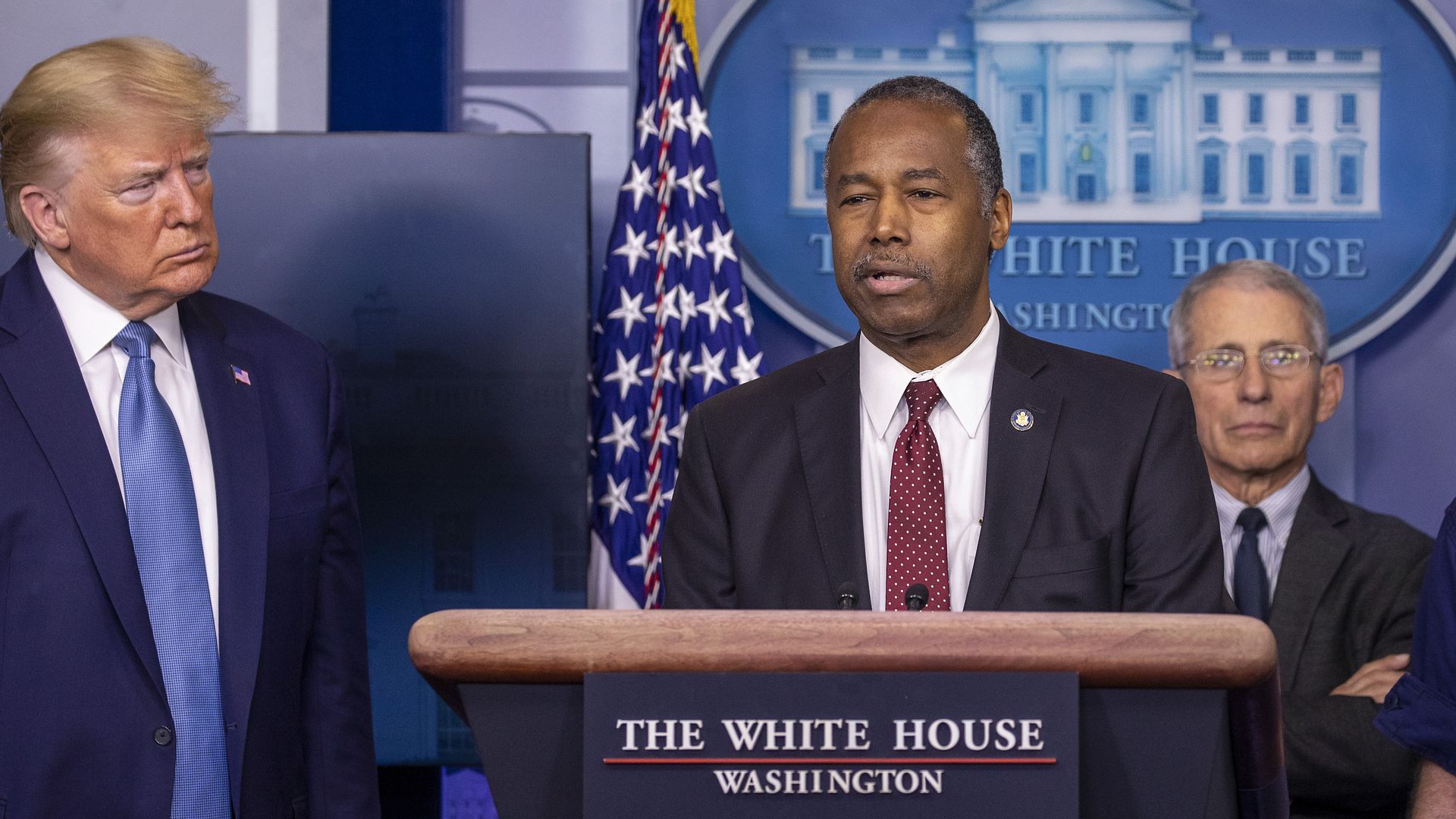 Ben Carson is seen speaking alongside President Trump and Dr. Anthony Fauci during a White House coronavirus briefing.