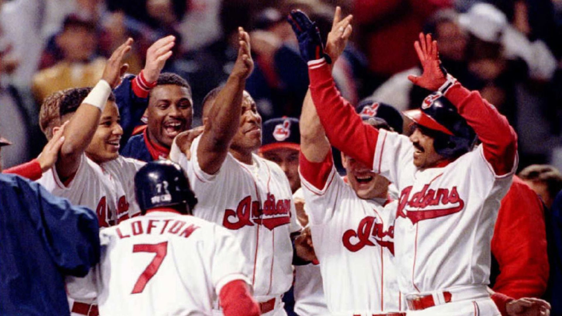 The Cleveland Indians players celebrate at home plate during a game-winning play. 
