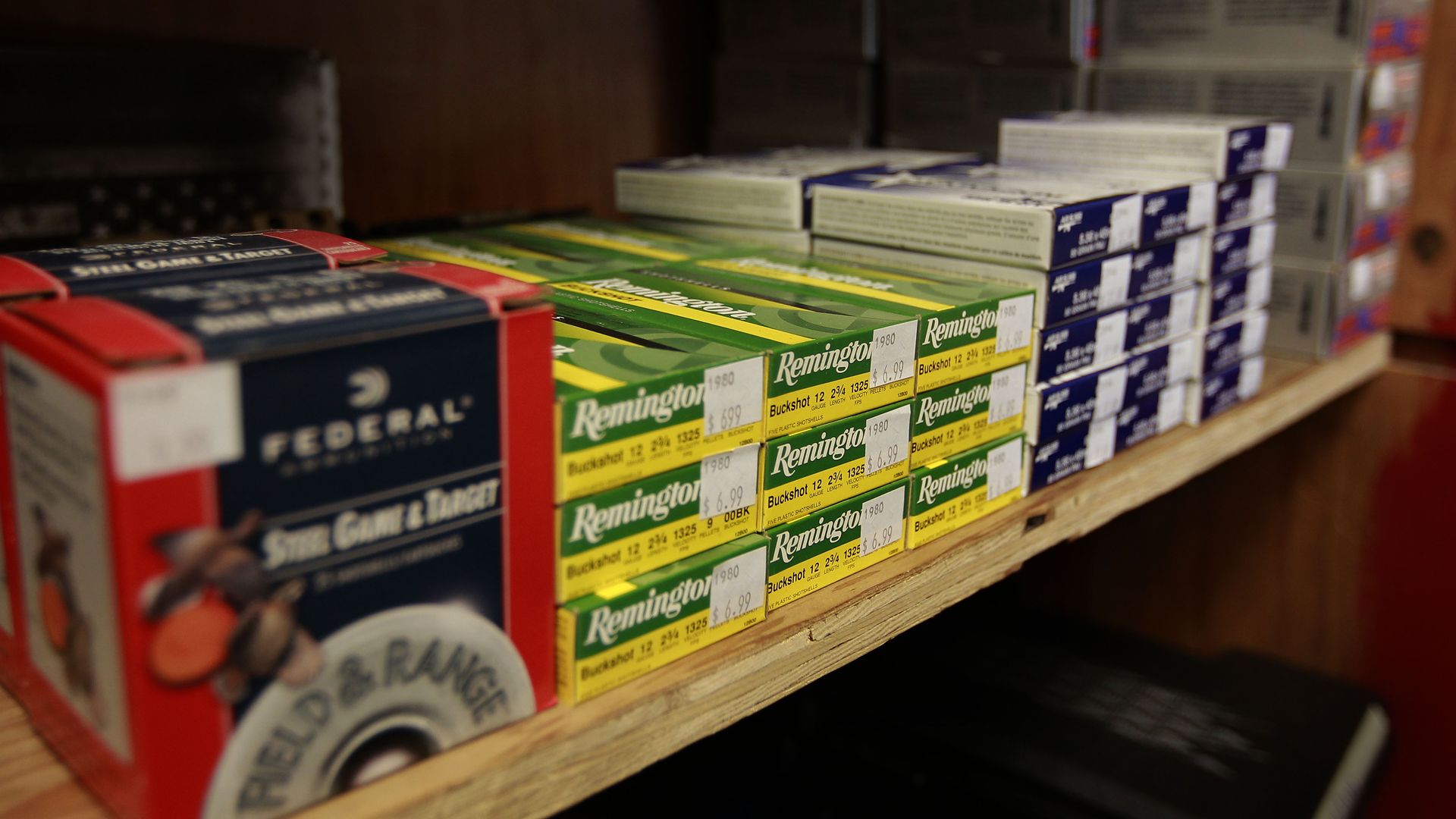 Ammunition sits on a shelf in a store. 