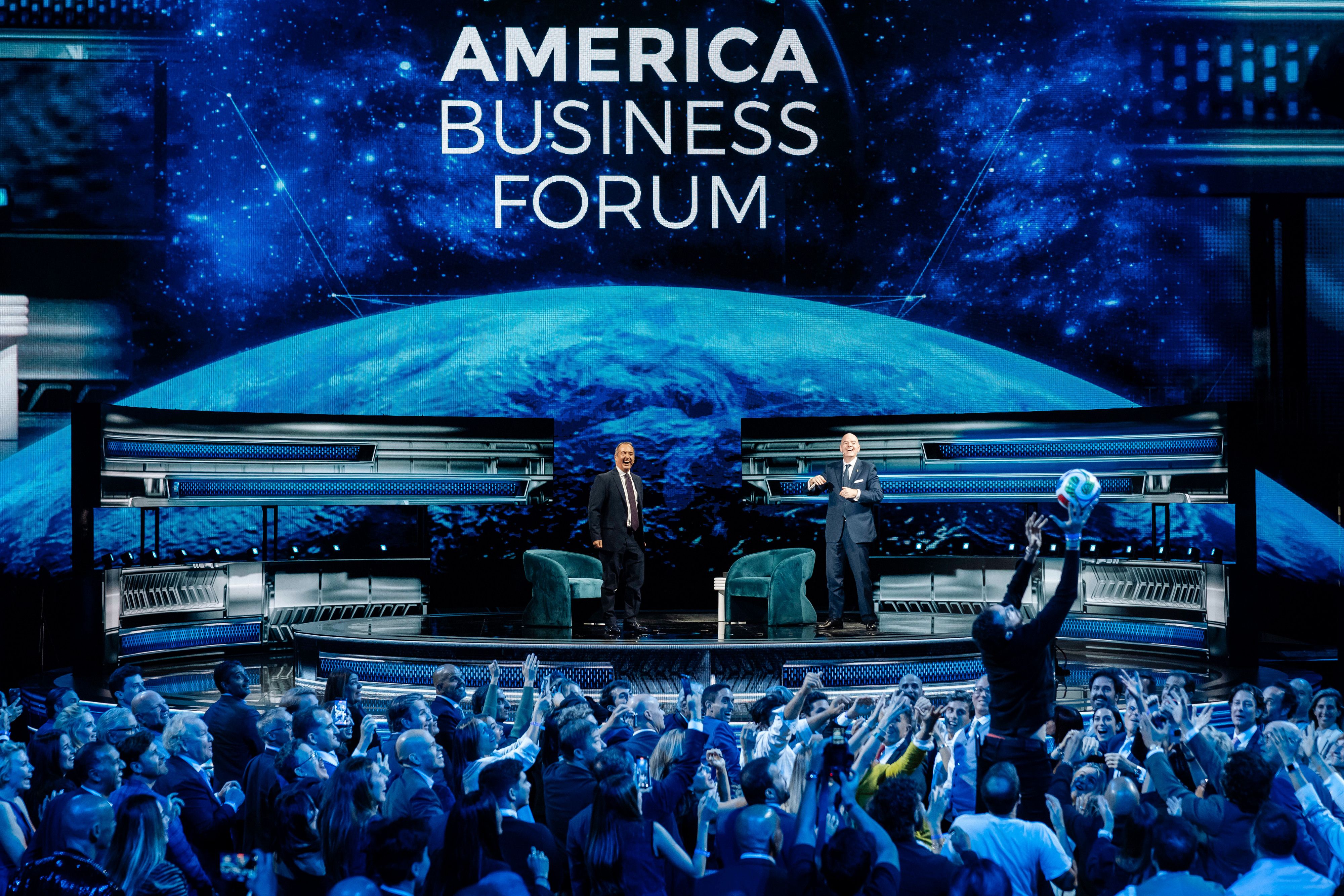Gianni Infantino, president of the Federation International Football Association (FIFA), tosses a soccer ball to an attendee during the America Business Forum in Miami, Florida, US, on Wednesday, Nov. 5, 2025. The forum brings together leaders in business, sports, culture, and technology. Photograph