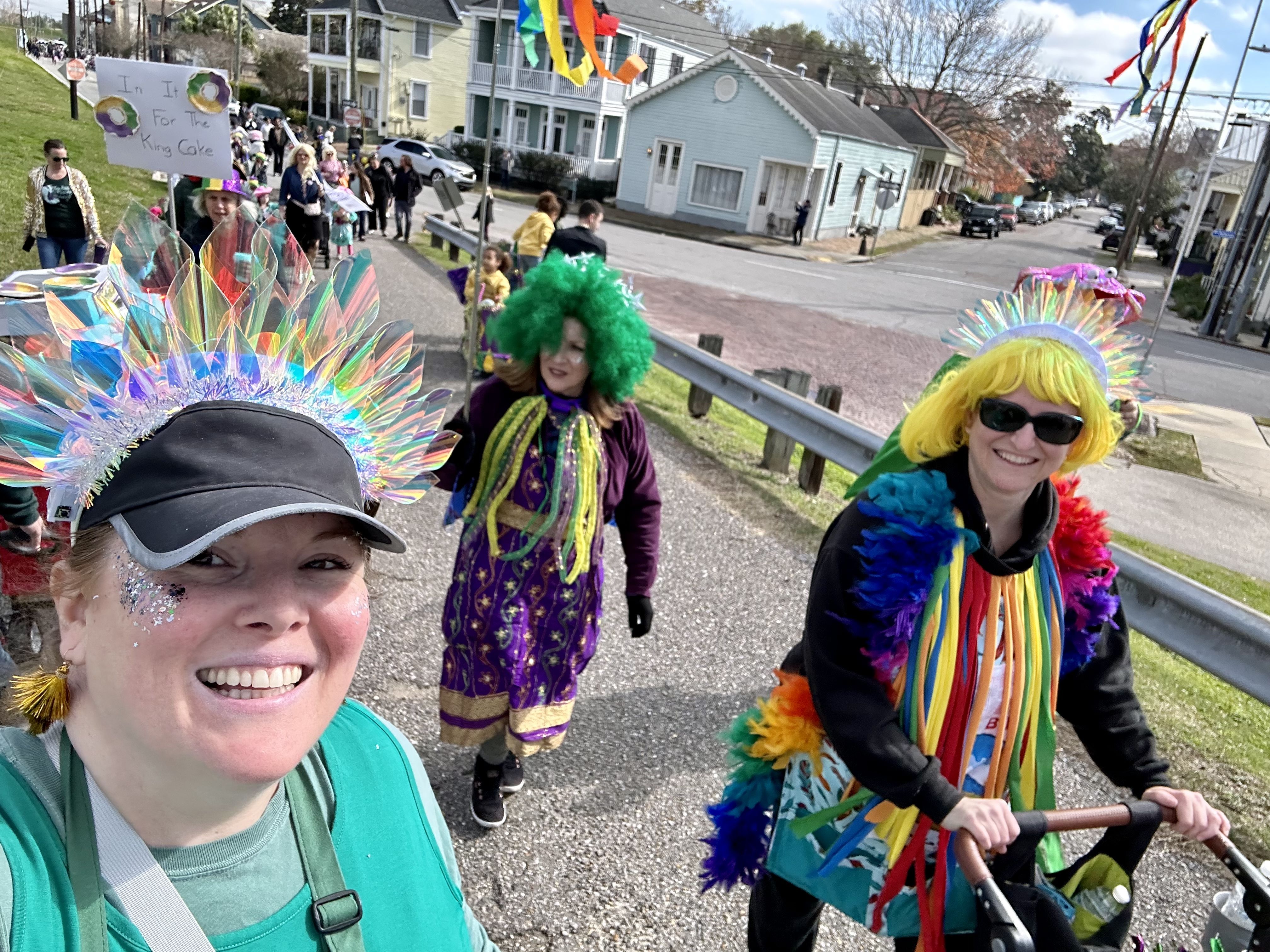 Photo shows children in costume walking in the Krewe of Confetti Kids parade in Algiers Point in New Orleans.