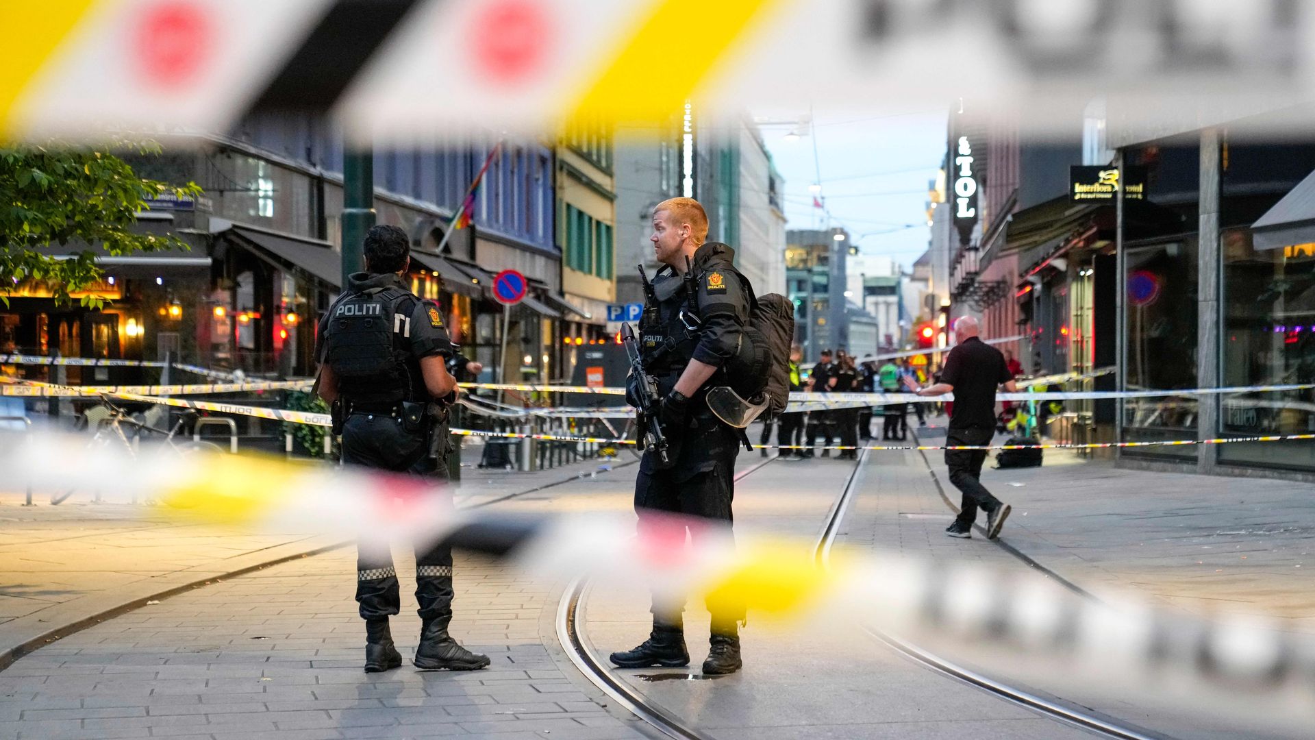 Norwegian police officers between security tape in Oslo on June 25.