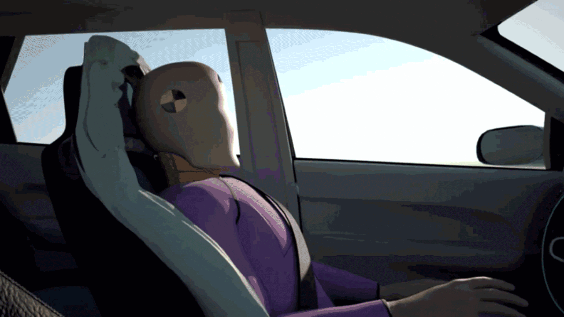 Car seat expanding to create a cushion around a crash dummy.