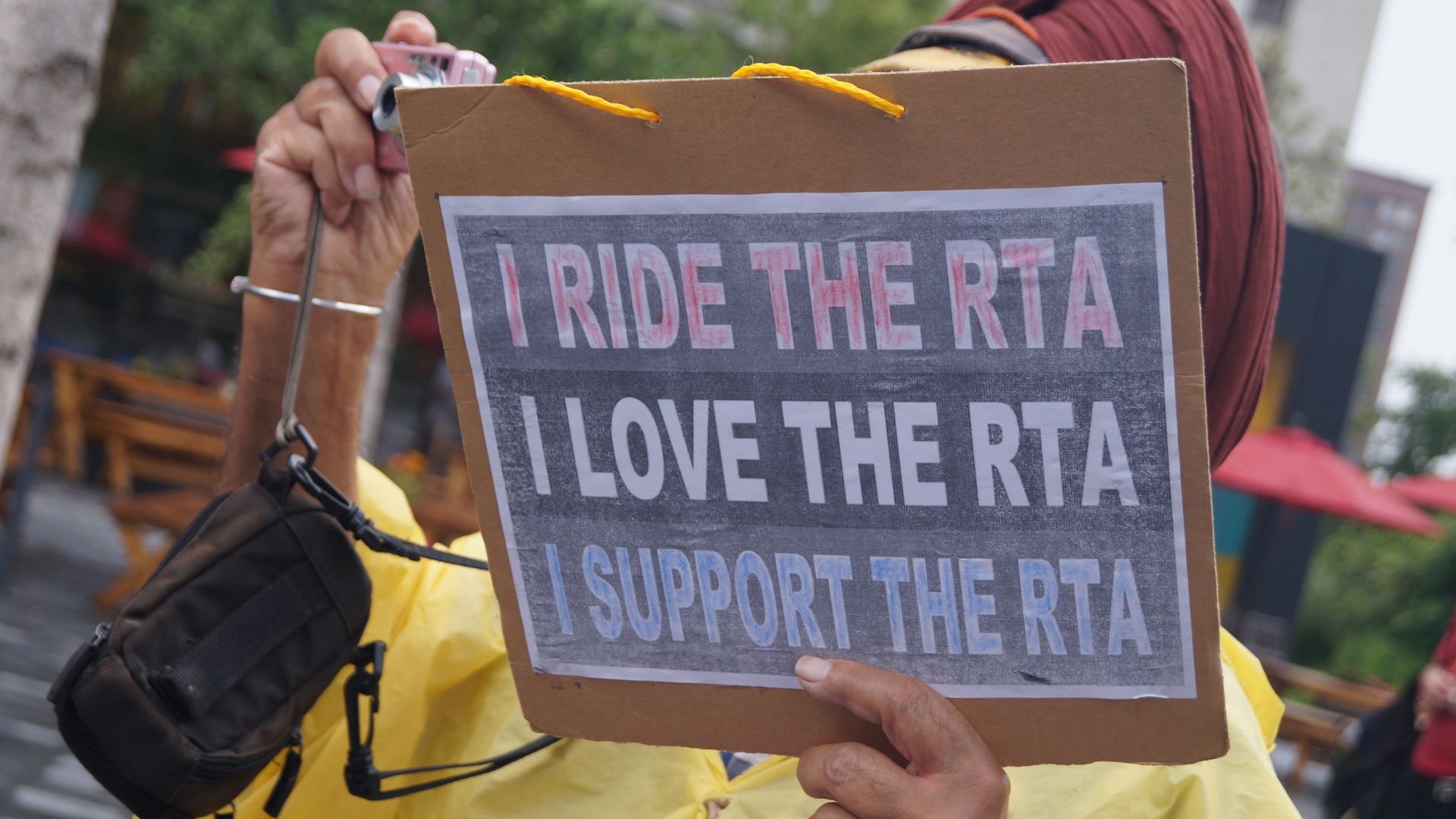 Protest sign that reads: I RIDE THE RTA / I LOVE THE RTA / I SUPPORT THE RTA (Cleveland Regional Transit Authority)