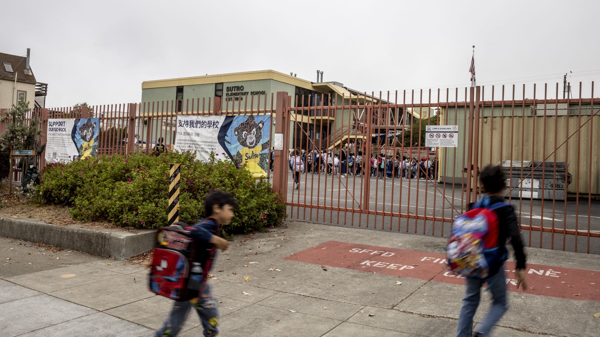 Children walk toward the gate at Sutro Elementary School in the Richmond. Photo: Stephen Lam/San Francisco Chronicle via Getty Images