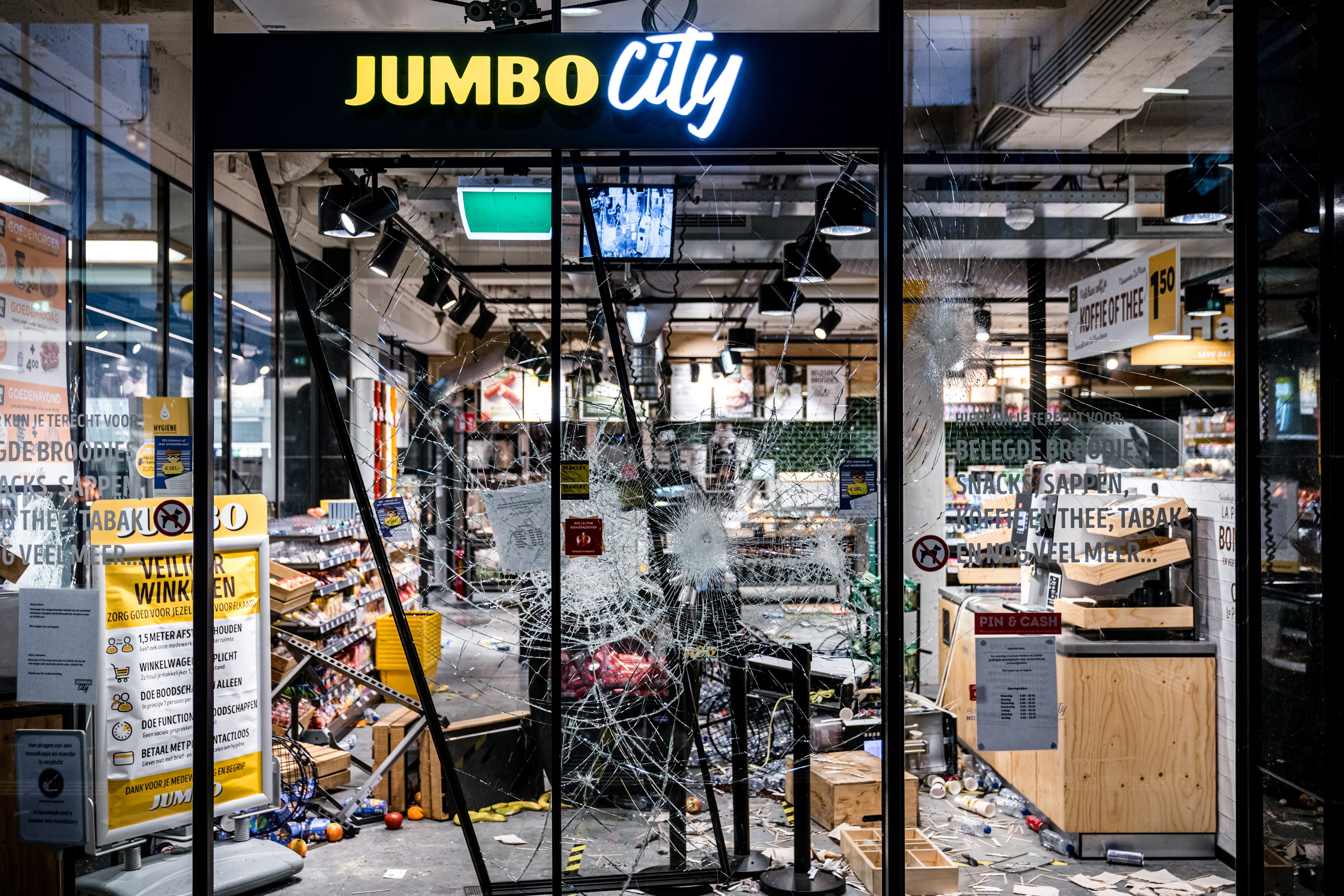 Photo of a shop that has been looted and destroyed