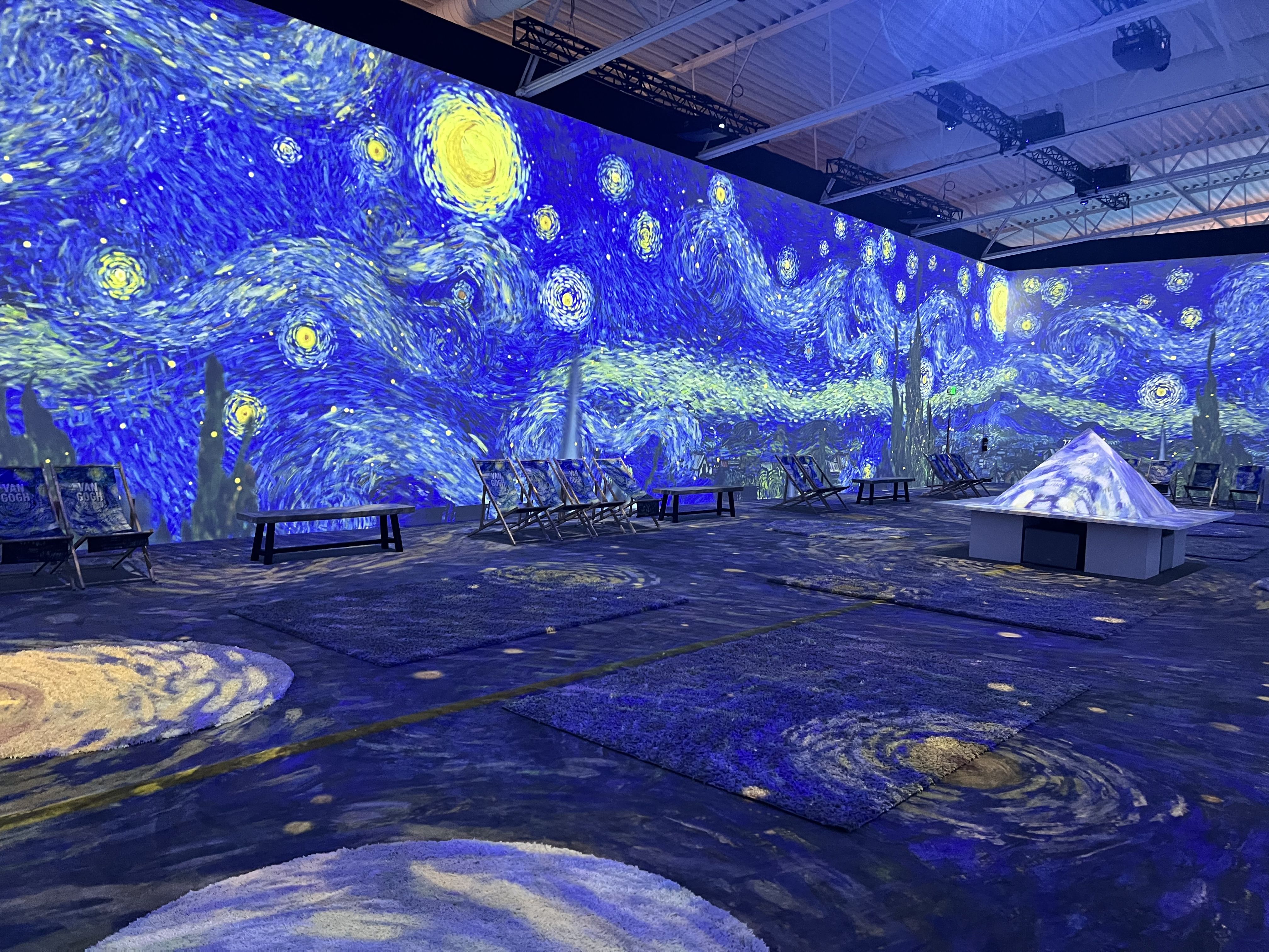 projections of Van Gogh's starry night in a massive room.