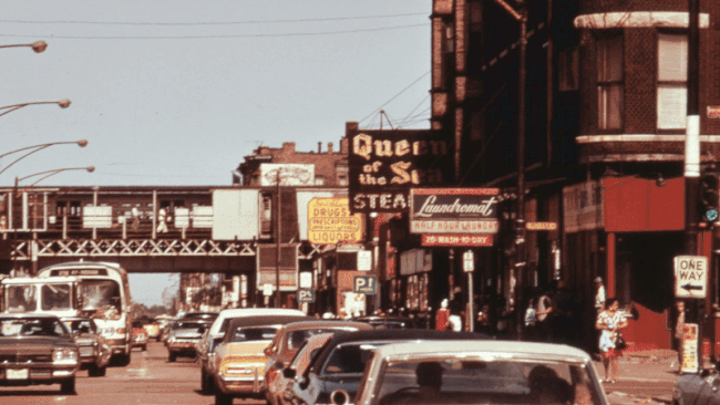 GIF of an old photo that fades into new video on the same street corner. 