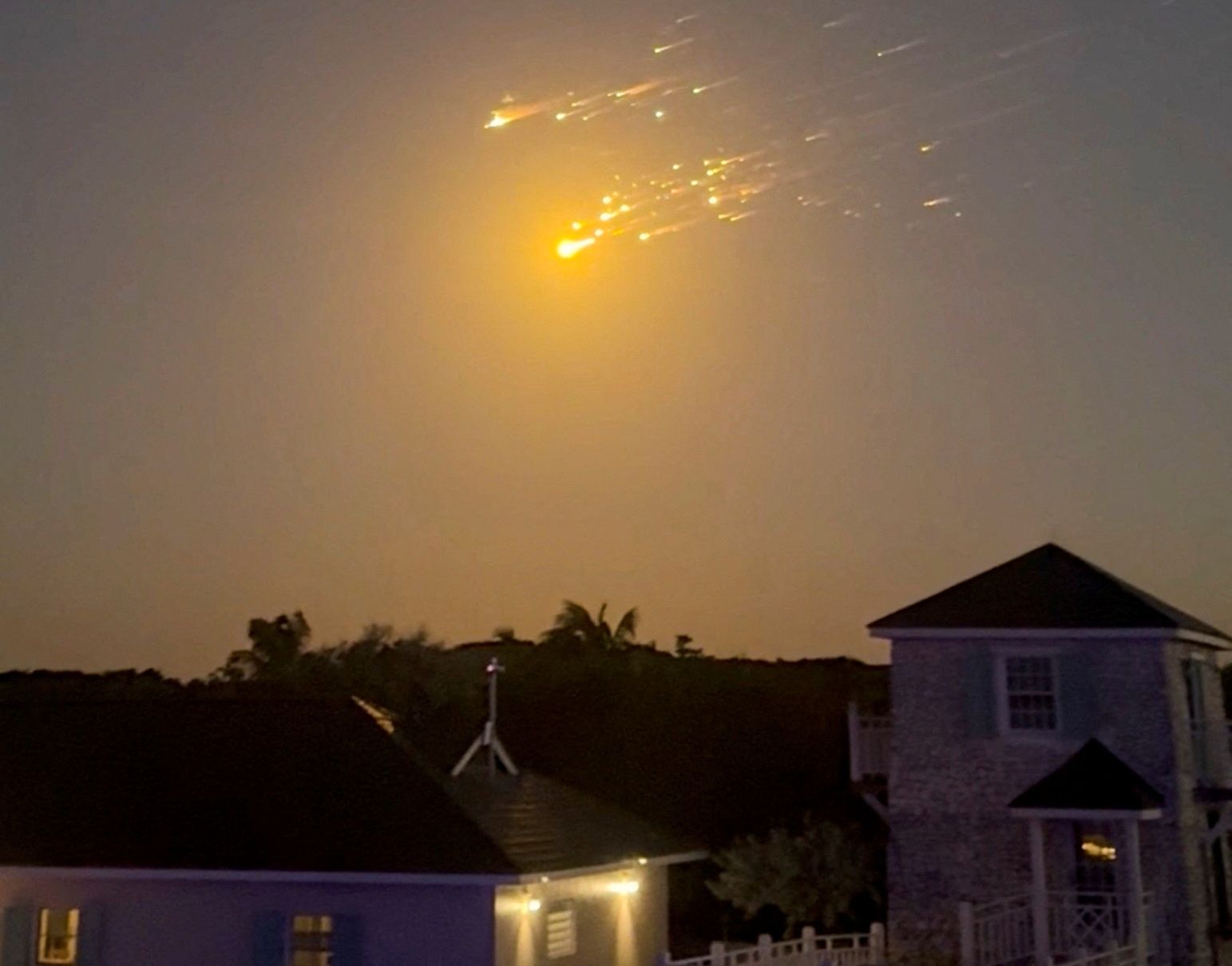 Debris from an exploded SpaceX Starship rocket streaks through the sky over the Bahamas last night.