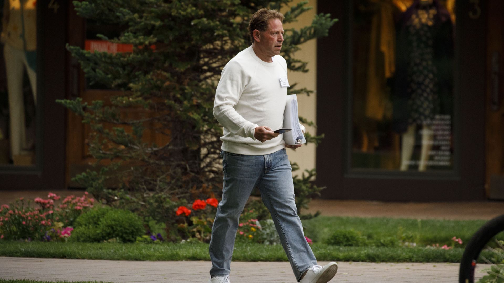 CEO Bobby Kotick walking down a sidewalk