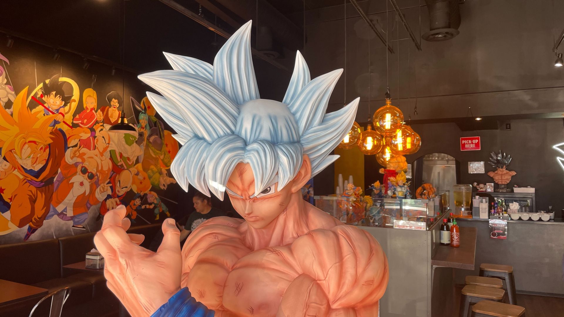 A life-sized statue of the "Dragon Super" character Goku at the Super Banh Mi eatery in Norcross.