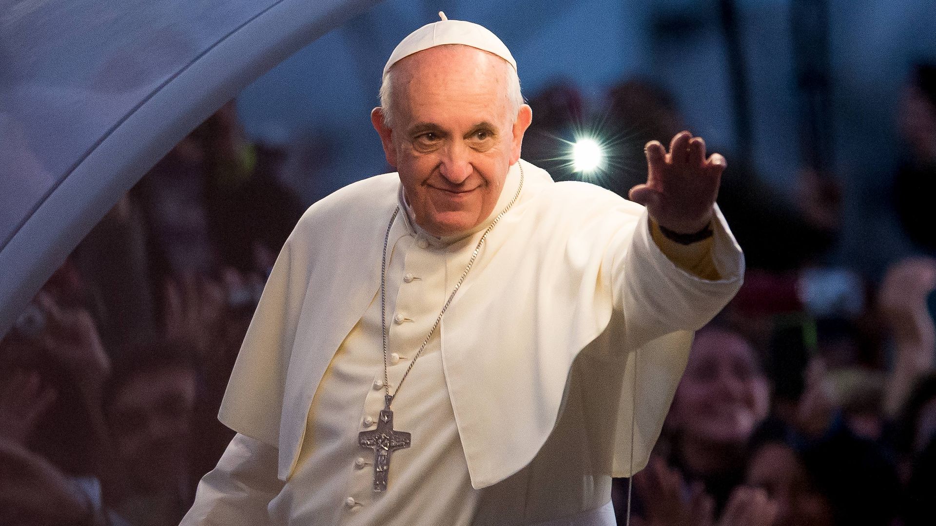 Pope Francis waves.