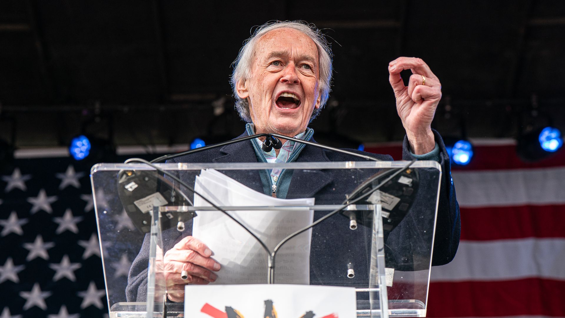 Alt text: Sen. Ed Markey speaks into a microphone at an outdoor event.
