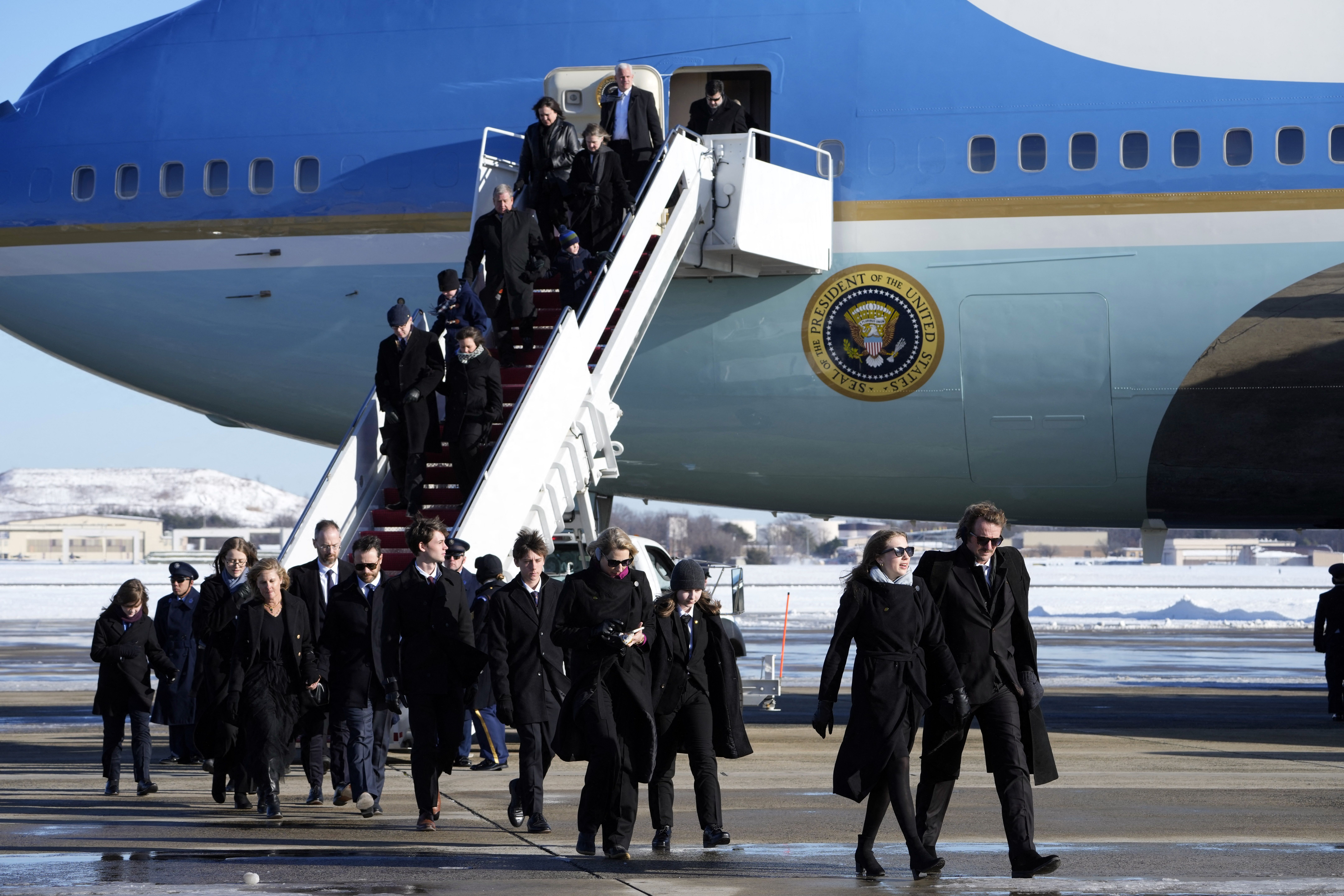 Members of the Carter family arrive on Special Air Mission 39, before the casket with the body of former US president Jimmy Carter is removed from the plane at Joint Base Andrews, Maryland on January 7, 2025. Carter, the 39th President of the United States, died at the age of 100 on December 29, 202