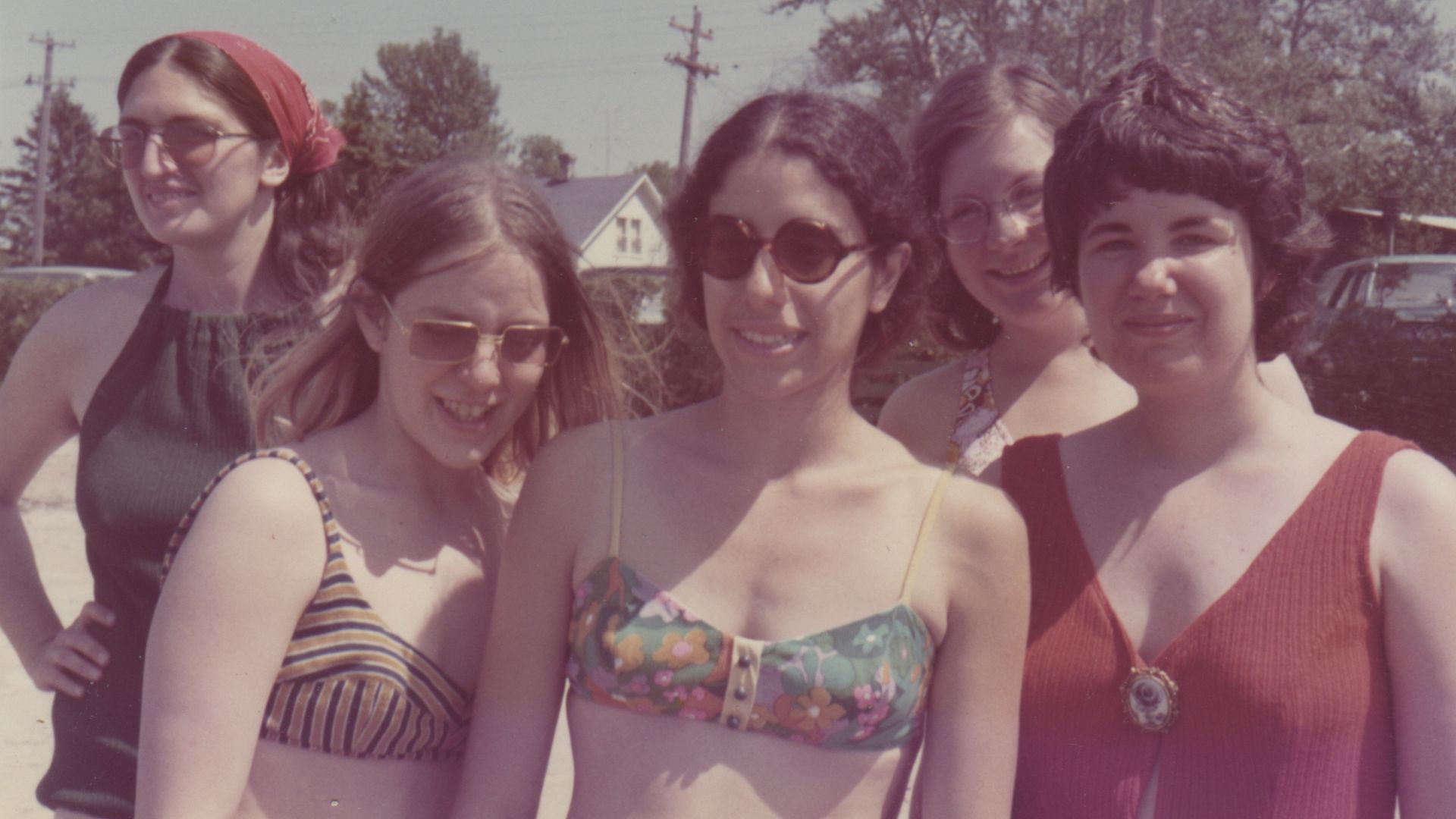 Photo of five women posing for the camera. 