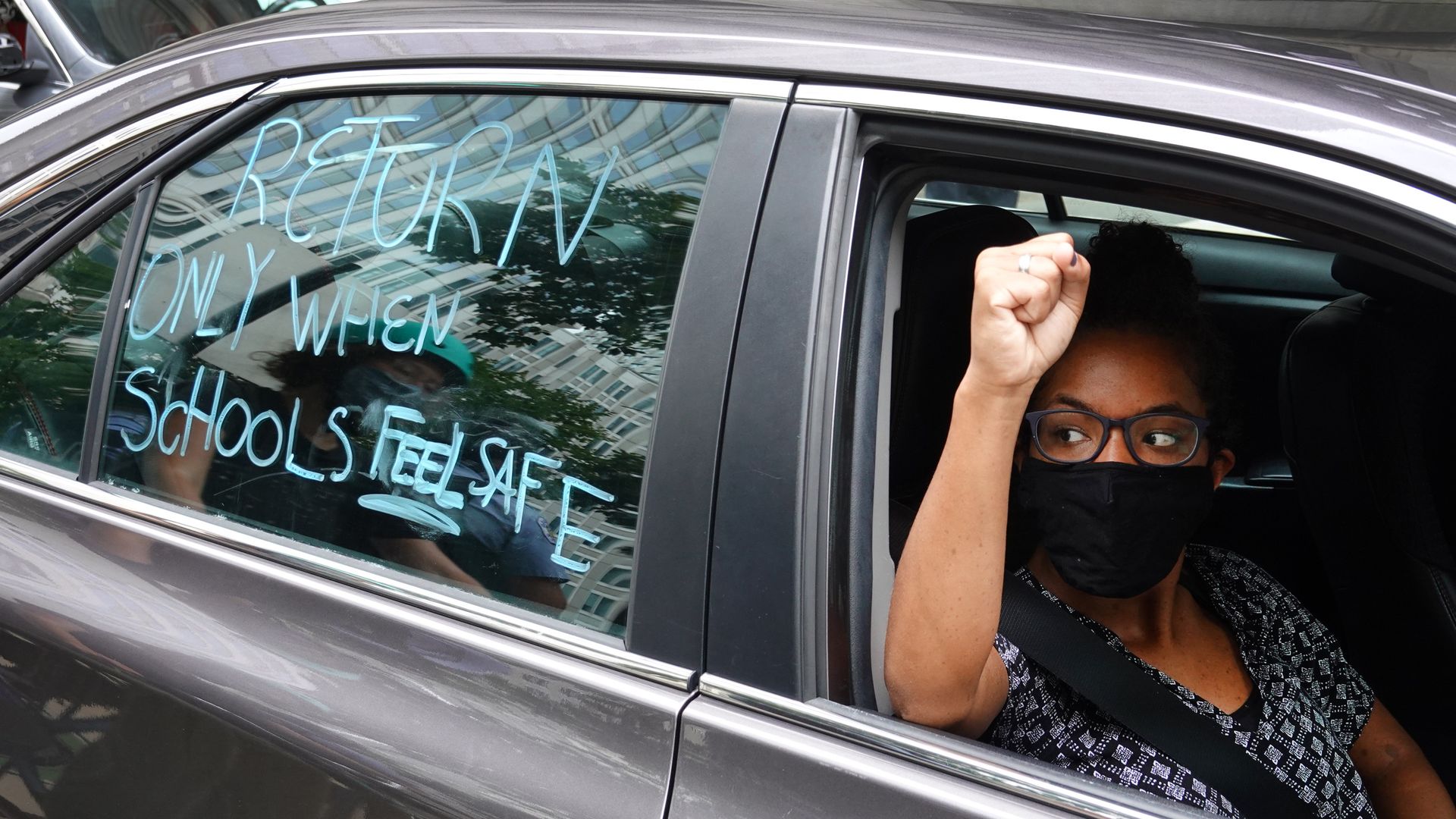 CHICAGO: Demonstrators participate in a car caravan protest calling for public school classes to be held remotely when school begins on August 03, 2020 in Chicago. (Photo by Scott Olson/Getty Images)