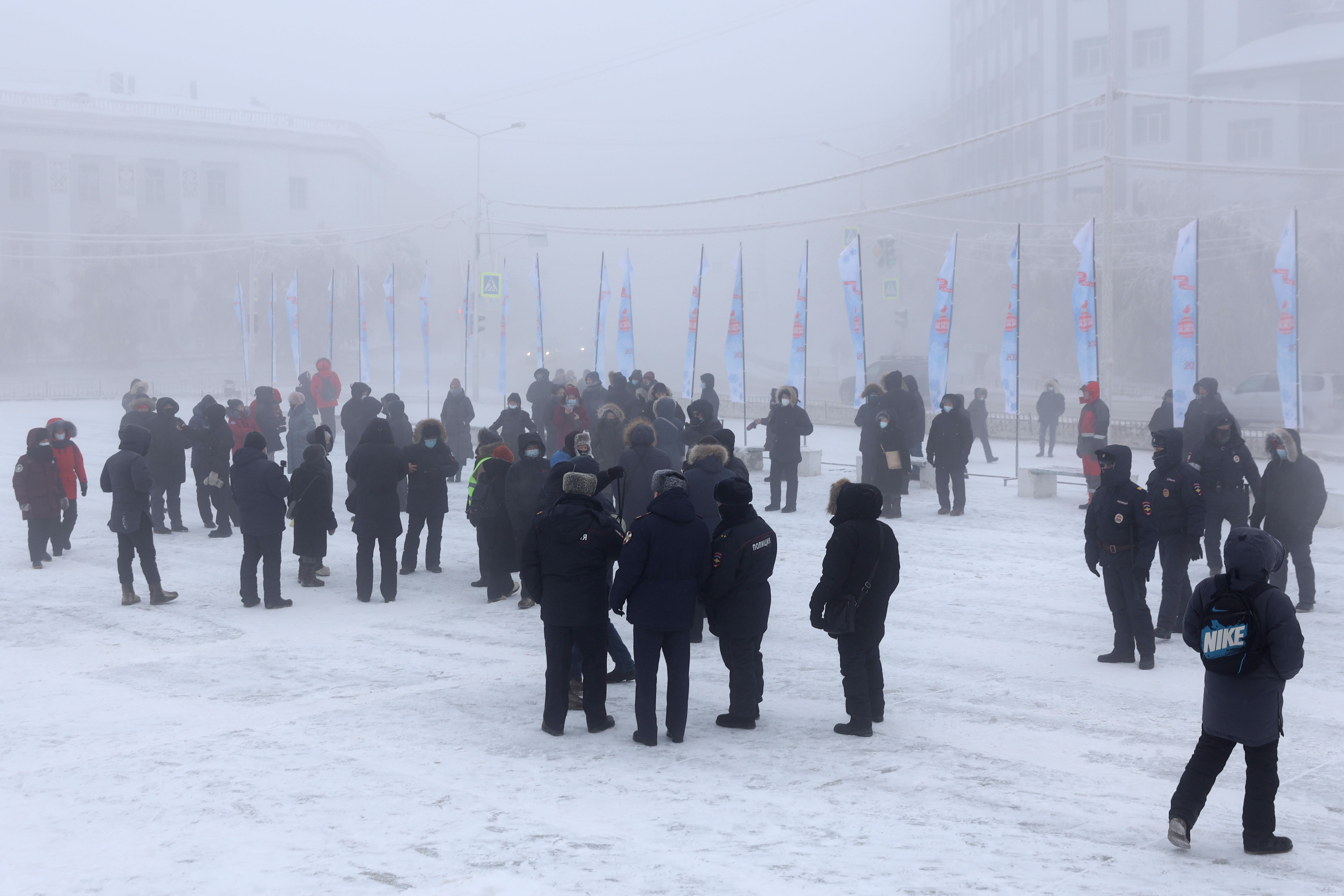 Demonstrators and police officers during a protest in support of the detained activist Alexei Navalny in Yakutsk, Republic of Sakha (Yakutia), in the Russian Far East.