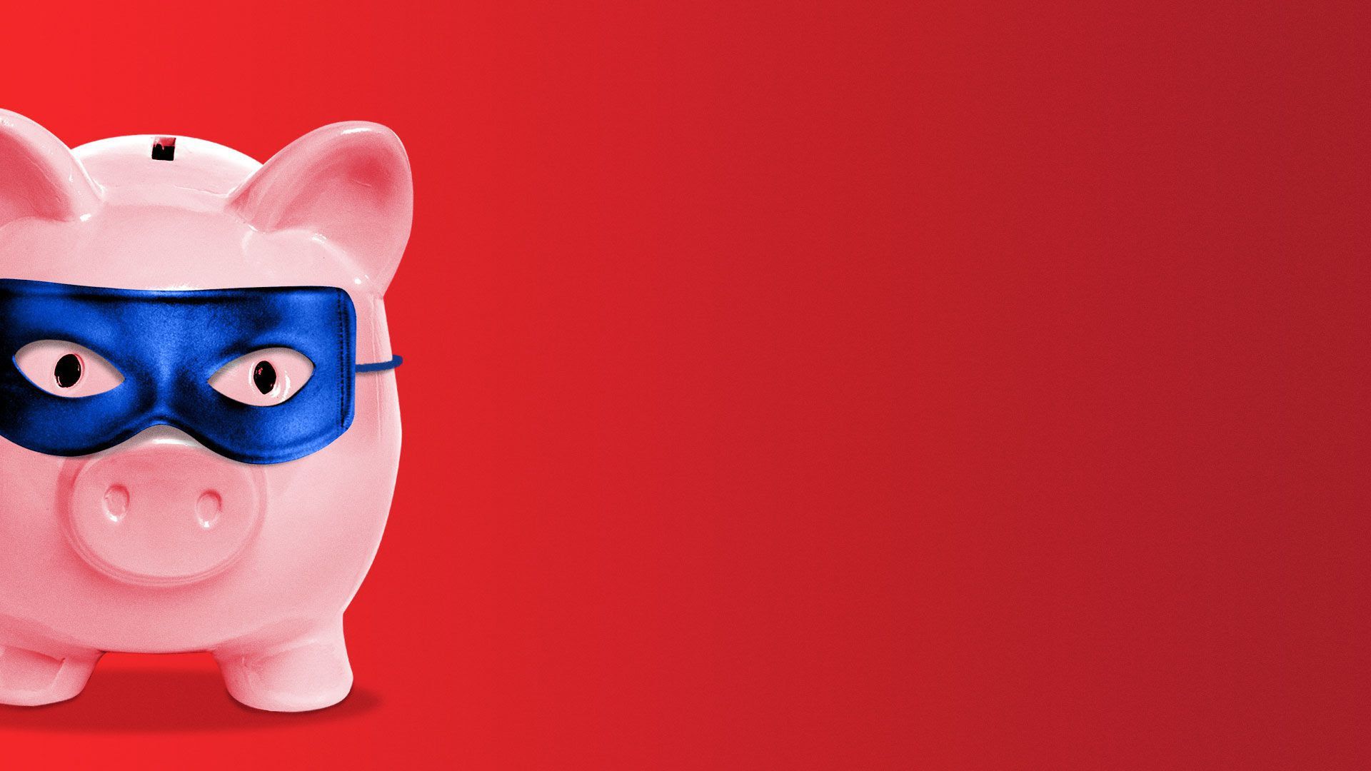 A pink piggy bank with a blue eye mask 
