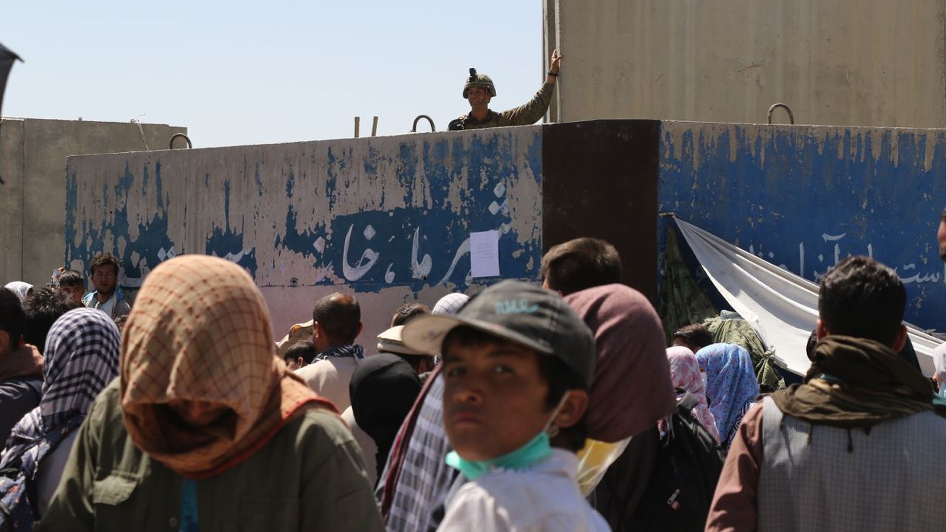 Afghans waiting outside Hamid Karzai International Airport in Kabul on Aug. 26.