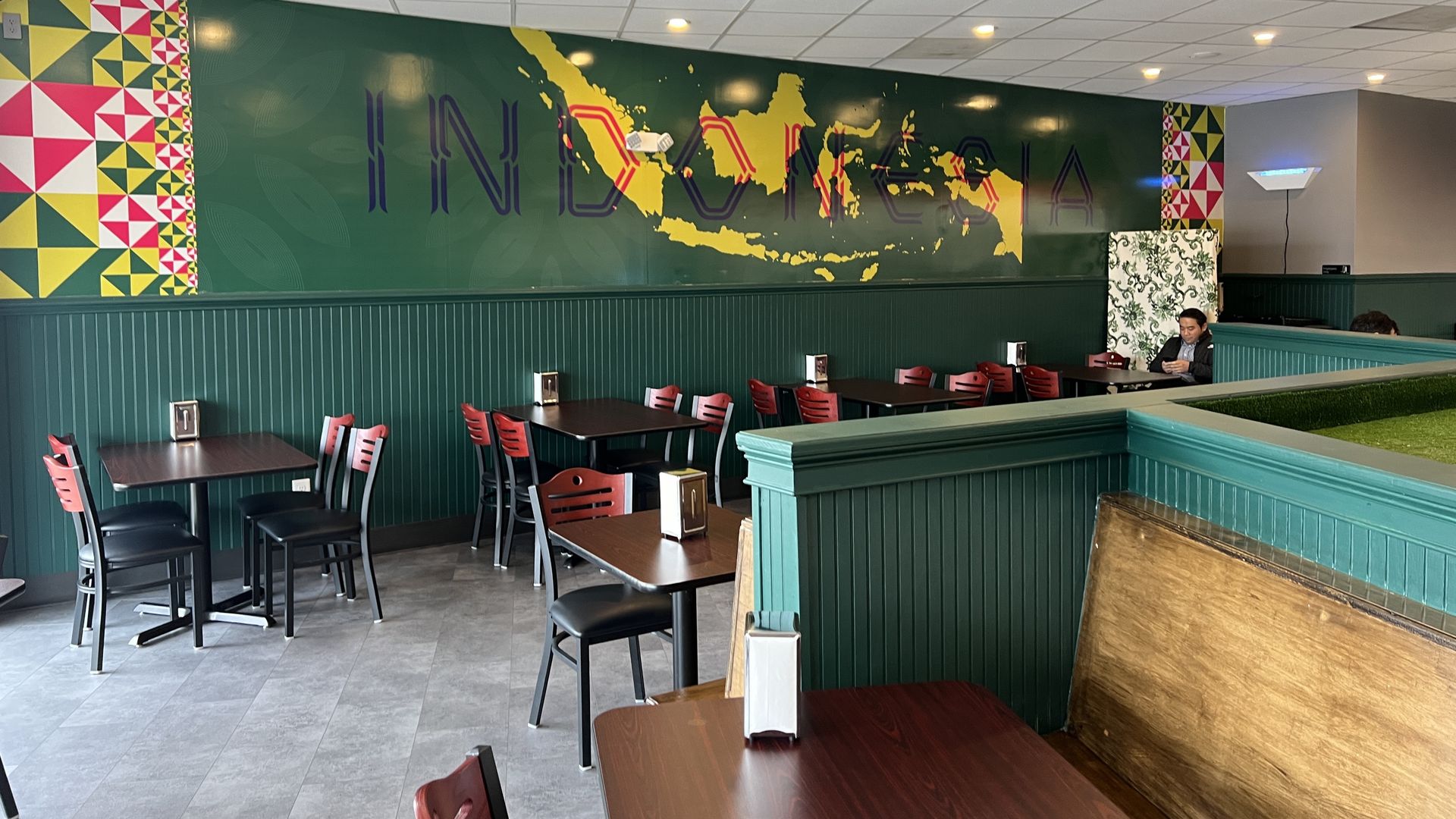 Inside restaurant with mural that reads "Indonesia"