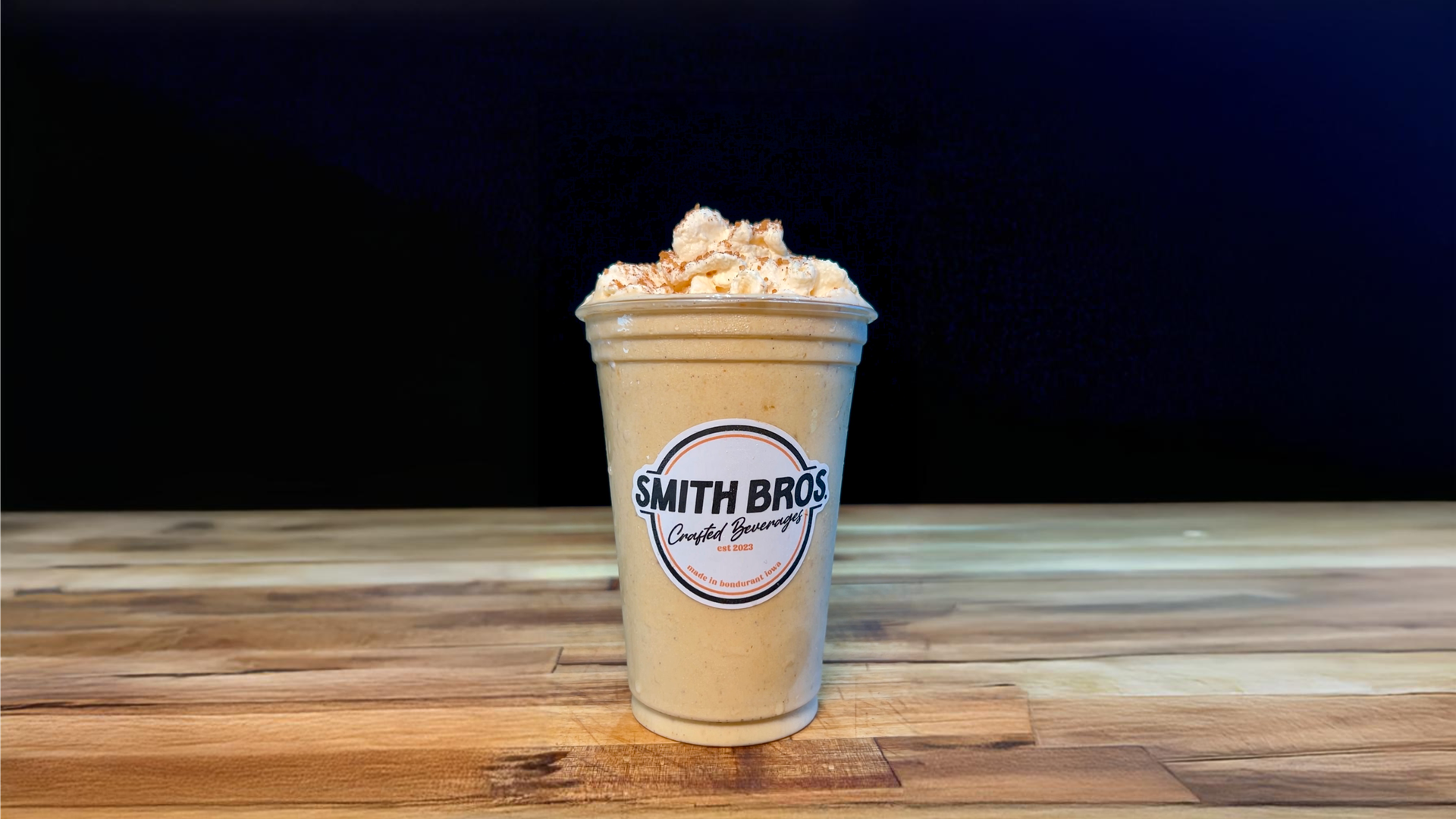 A pumpkin pie shake on a table