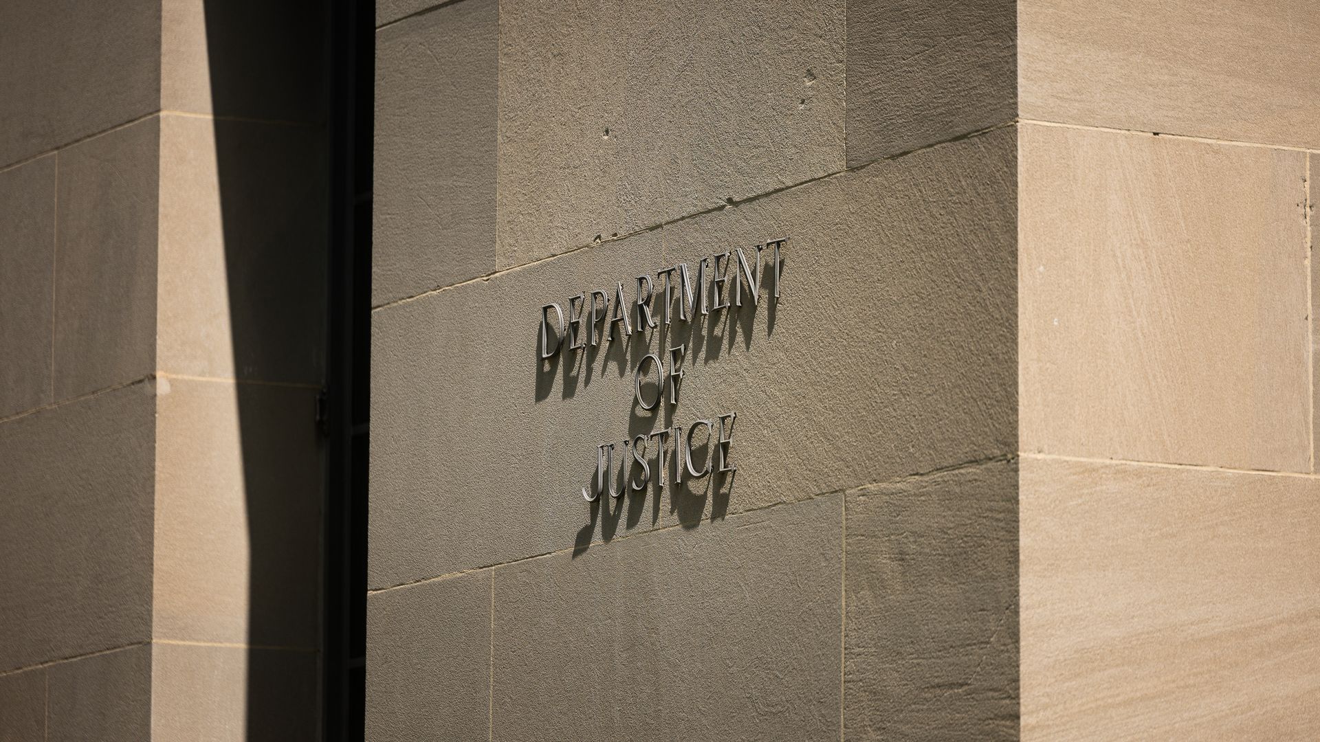 : The US Department of Justice building is seen on August 21, 2024 in Washington, DC. (Photo by Tierney L. Cross/Getty Images)