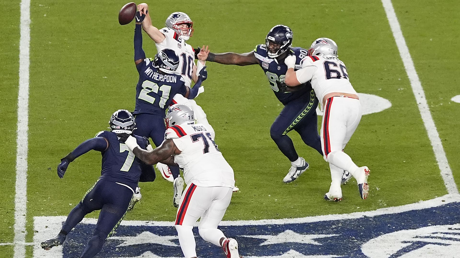 The Seahawks' Devon Witherspoon forces a fumble against Drake Maye during the Super Bowl in Santa Clara, California.