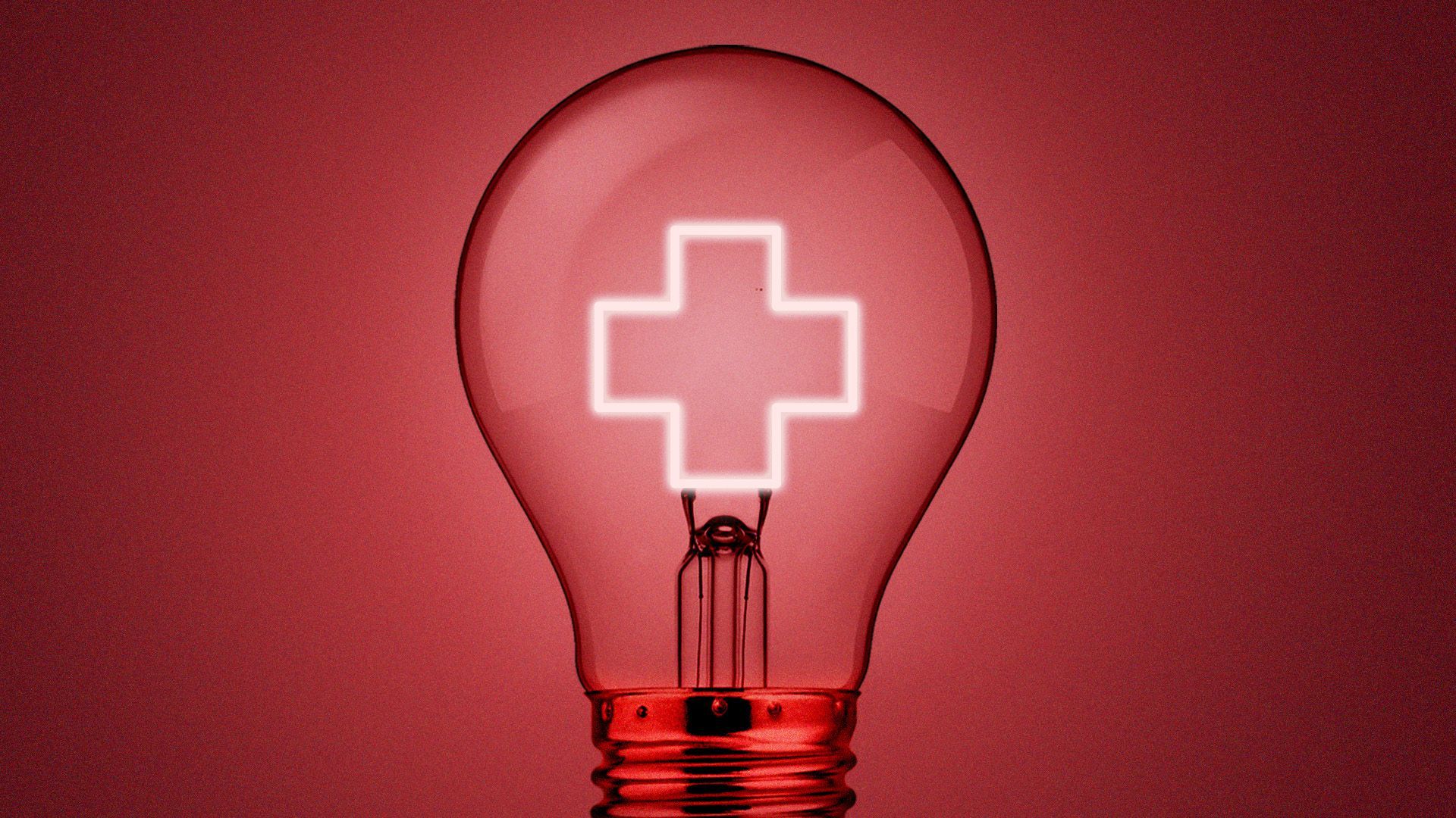 a lightbulb with a glowing medical cross filament