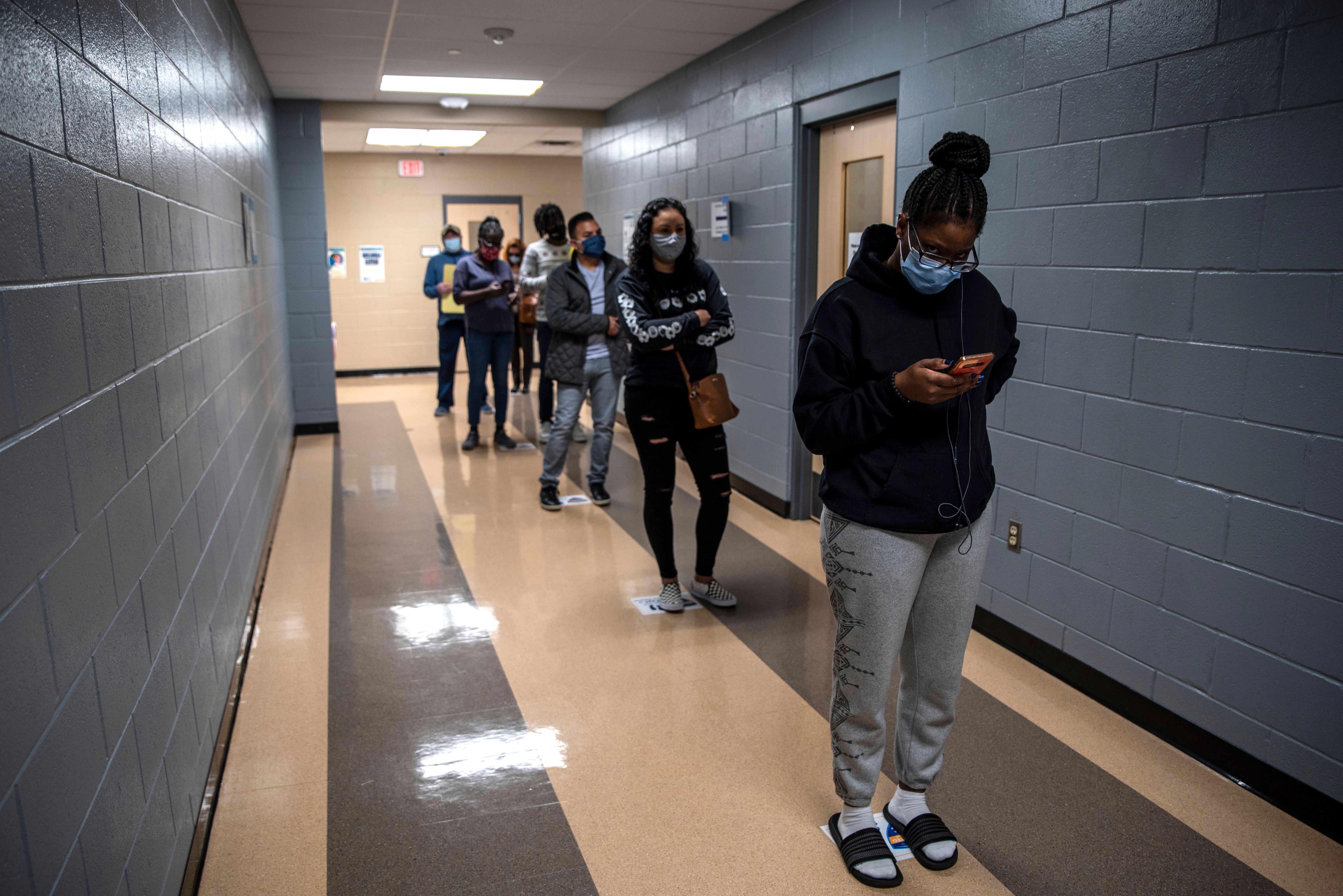 Voters wait in line at a polling location on election day on November 3, 2020 in Austin, Texas.
