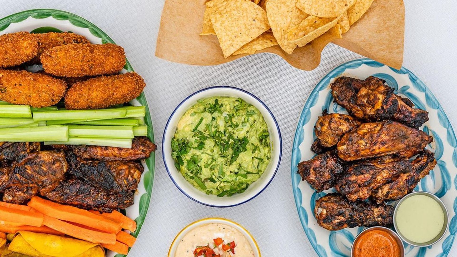 A photo of multiple plates of food on a table