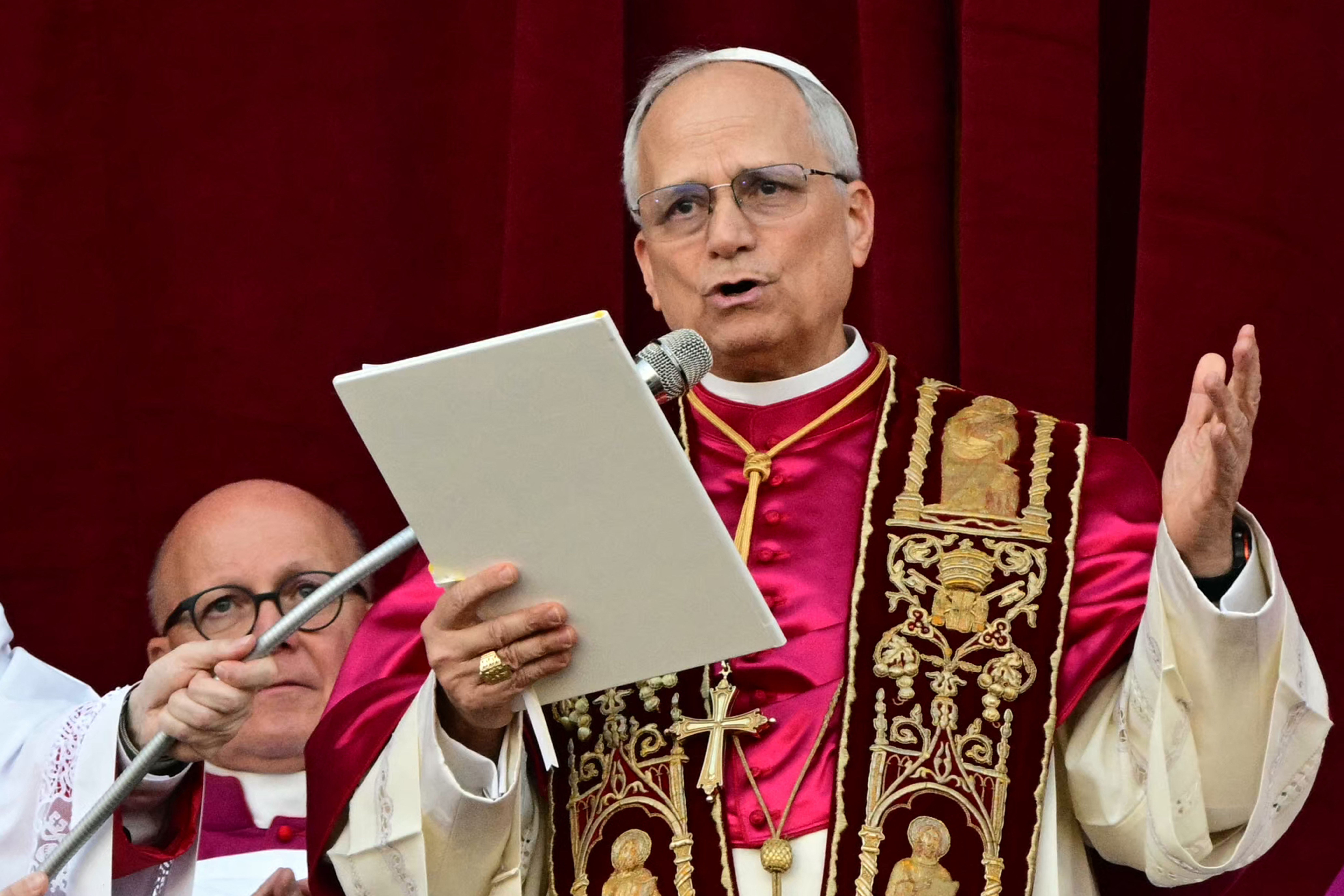 Newly elected Pope Leo XIV, Robert Prevost addresses the crowd on the main central loggia balcony of the St Peter's Basilica for the first time
