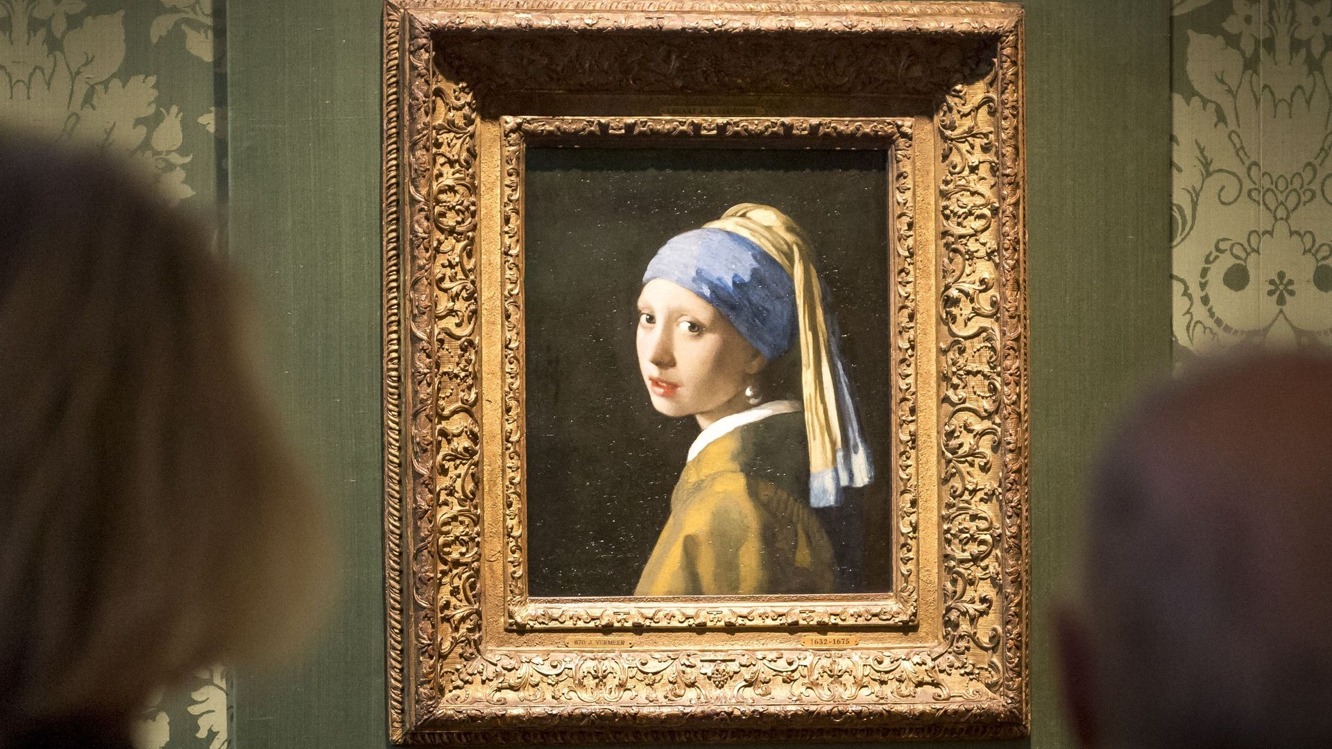 People viewing Johannes Vermeer's painting "Girl with a Pearl Earring" at the Mauritshuis museum in The Hague on Oct. 27.