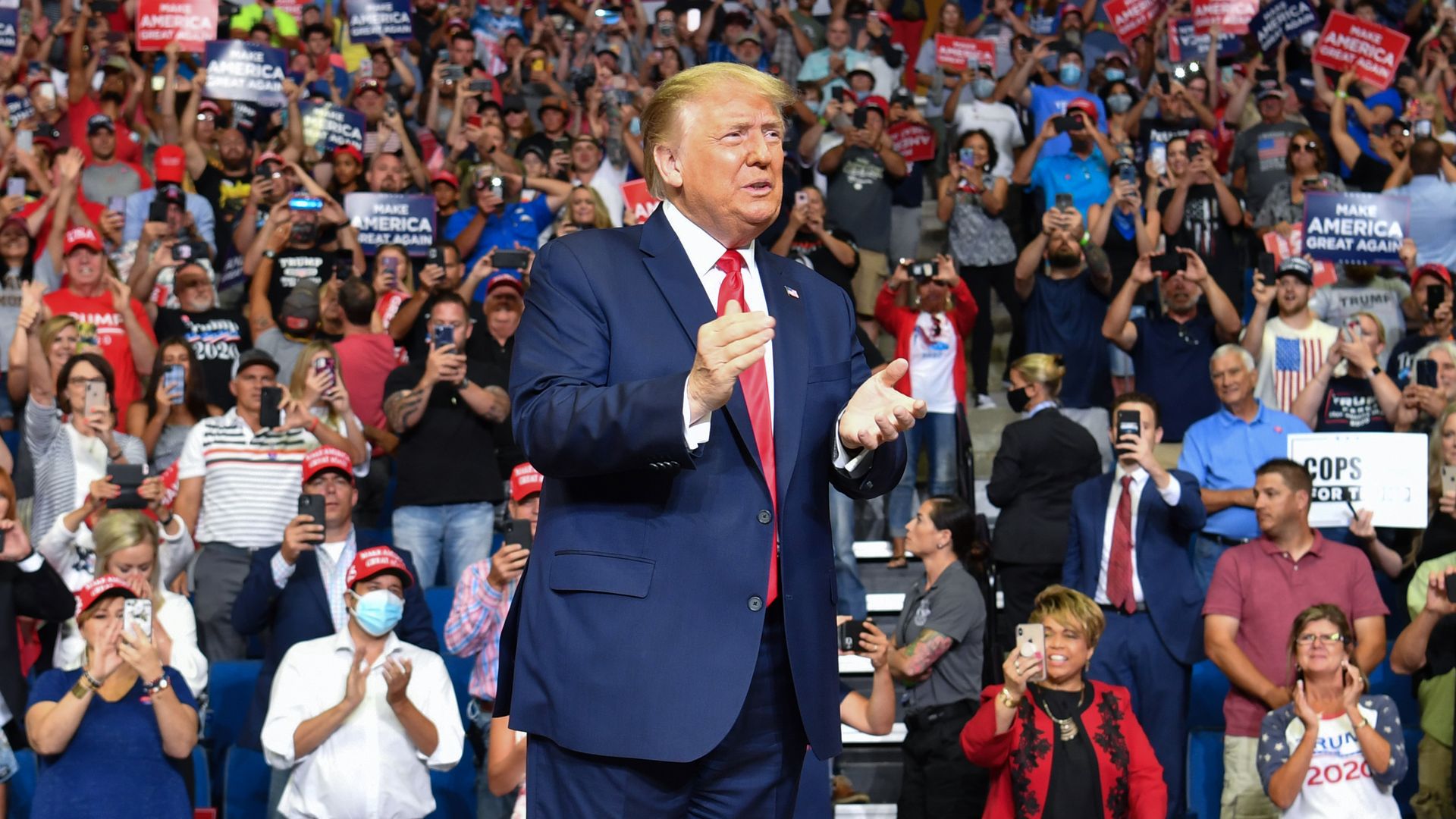 This photo of Trump at a campaign rally in Tulsa includes a crowd member wearing a face mask