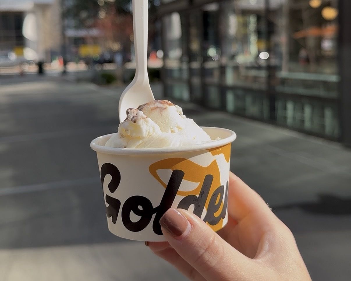 Hand holding an ice cream.